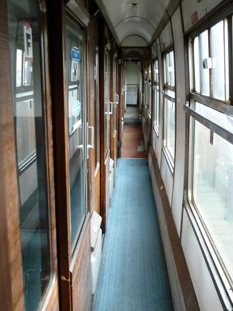 ...and the "Harry Potter" coach that offers 5 private compartments, each seating six. It's only in the past year that this coach was transformed to First Class requiring assigned seating.