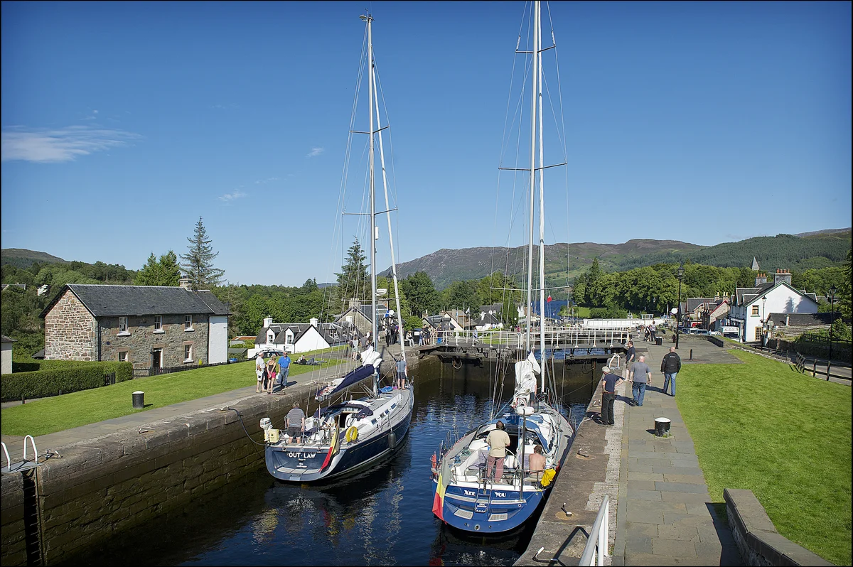 If sailing the open sea seems a bit too adventurous, Scotland offers inland canals and lochs as an alternative. Boats descending Fort Augustus Locks into Loch Ness © Peter Sandground