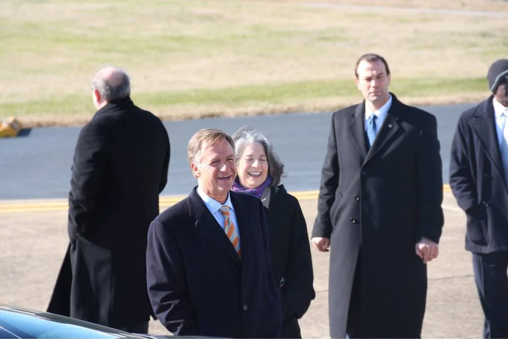 Smiling (left to right): Governor Bill Haslam (R-Tennessee) and Mayor Madeline Rogero (D-Knoxville) welcoming the president and vice president of the United States at McGhee Tyson Air National Guard Base in Lousville, TN, photograph by Nick Kivi