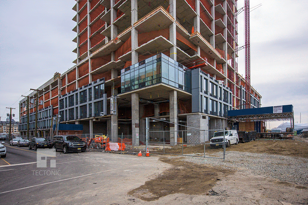 Facade installation at the base of the tower