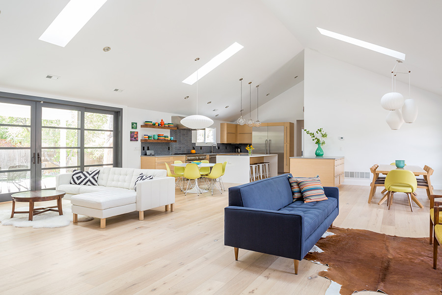 Angela Feddersen designed this great room to maintain clear circulation with an uncluttered path into an open kitchen and, just beyond, an added half-bath and mud room. "This client really wanted a space that would complement their beautiful modern furniture," she says. (photo courtesy of JC Buck and Modern in Denver)