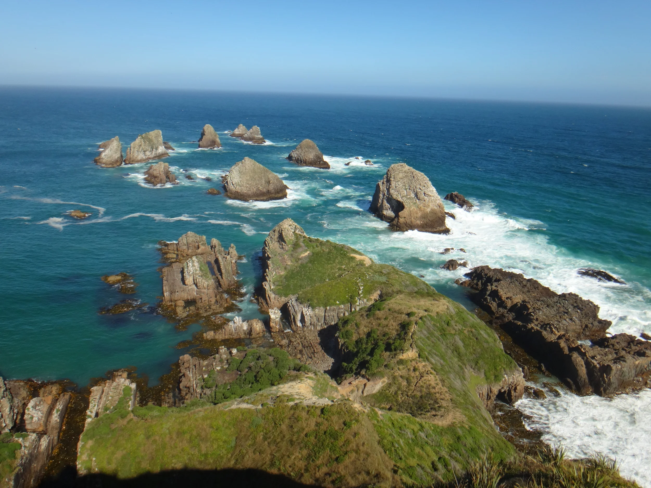 Nugget Point, calm and rough seas meeting