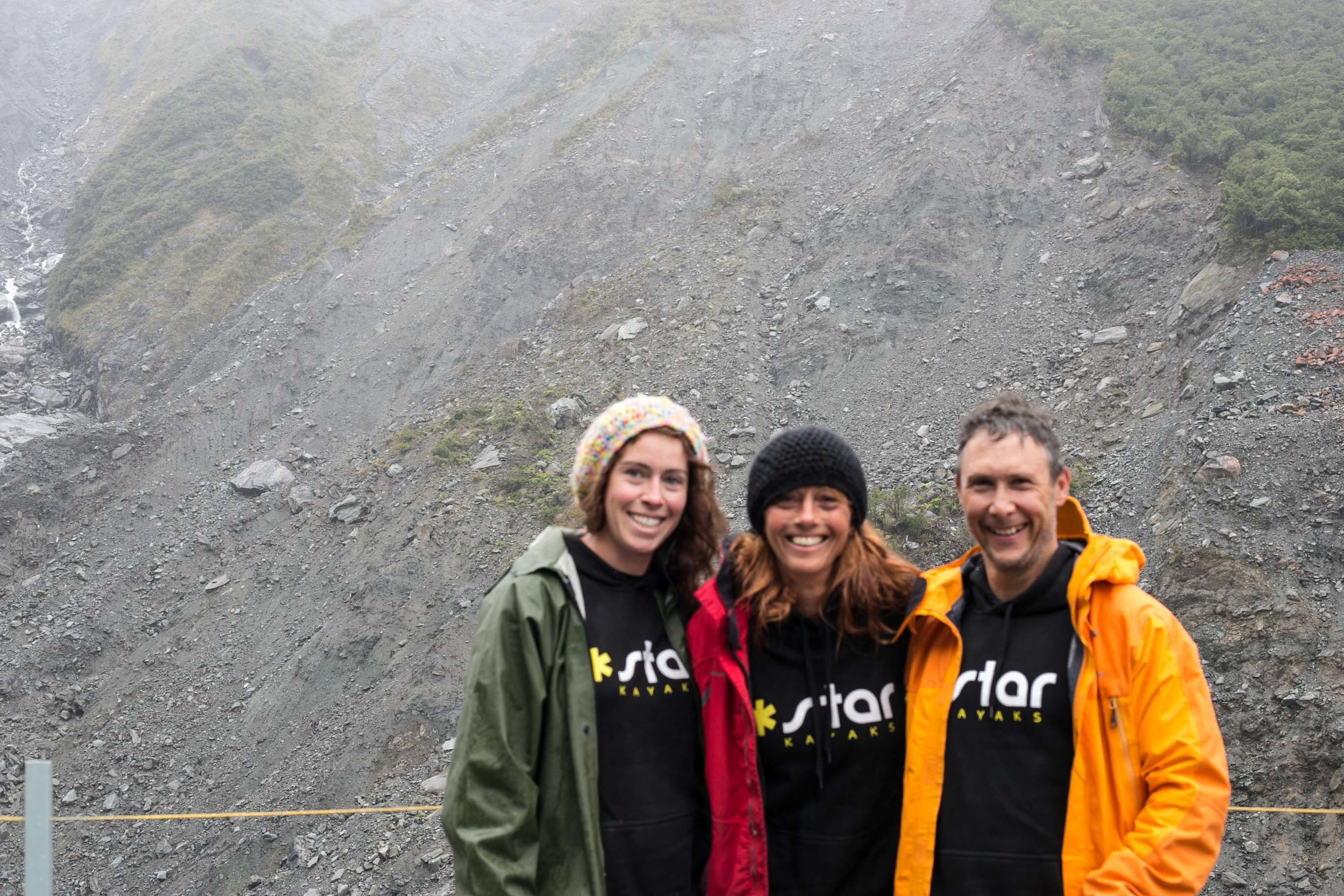 An example of why I should get a tripod. To the left of this photo is the glacier. At least we look cool in our traffic light rain jackets.
