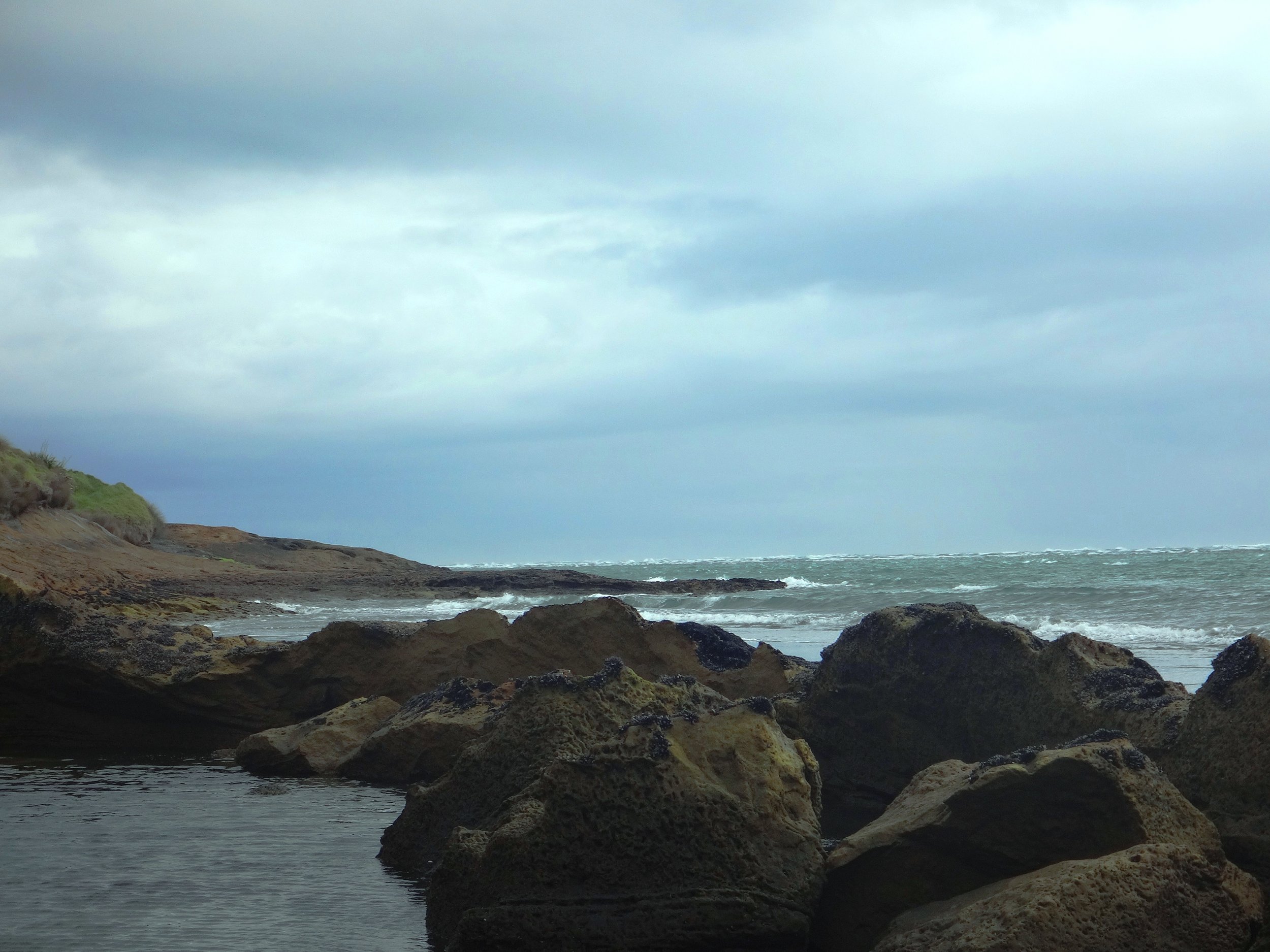 Rocks, rock-pools and harbour waves.