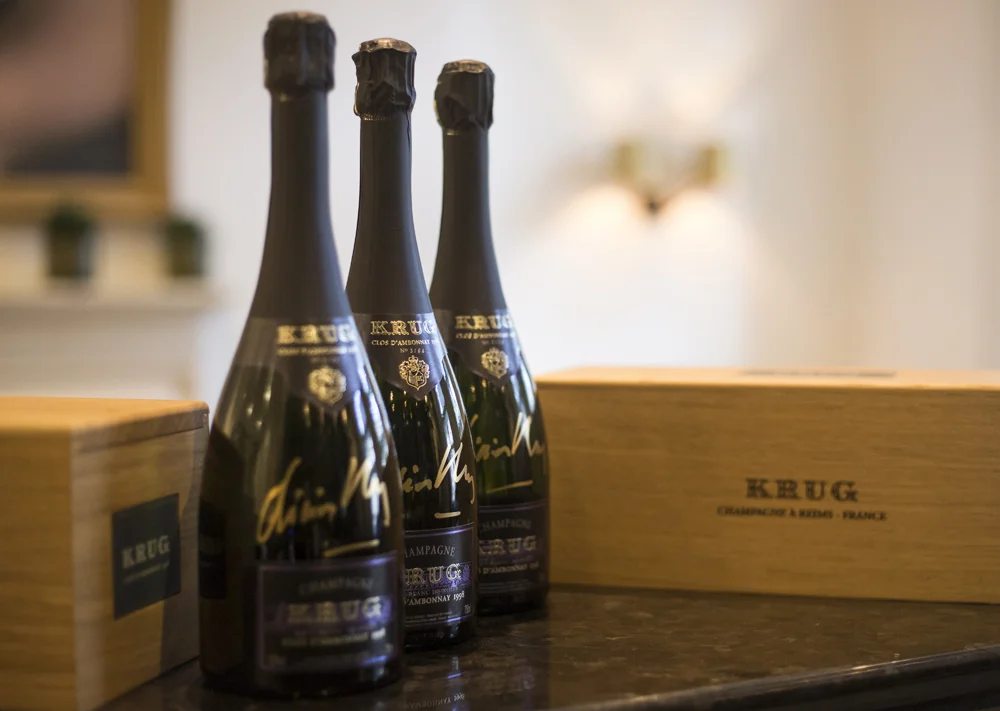 Limited-edition bottles of Krug Clos d'Ambonnay 1998 champagne autographed by Olivier Krug to auction for Save the Children .