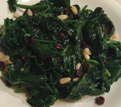  Sautéed spinach with raisins and pine nuts. Easy, simple and delicious. 
