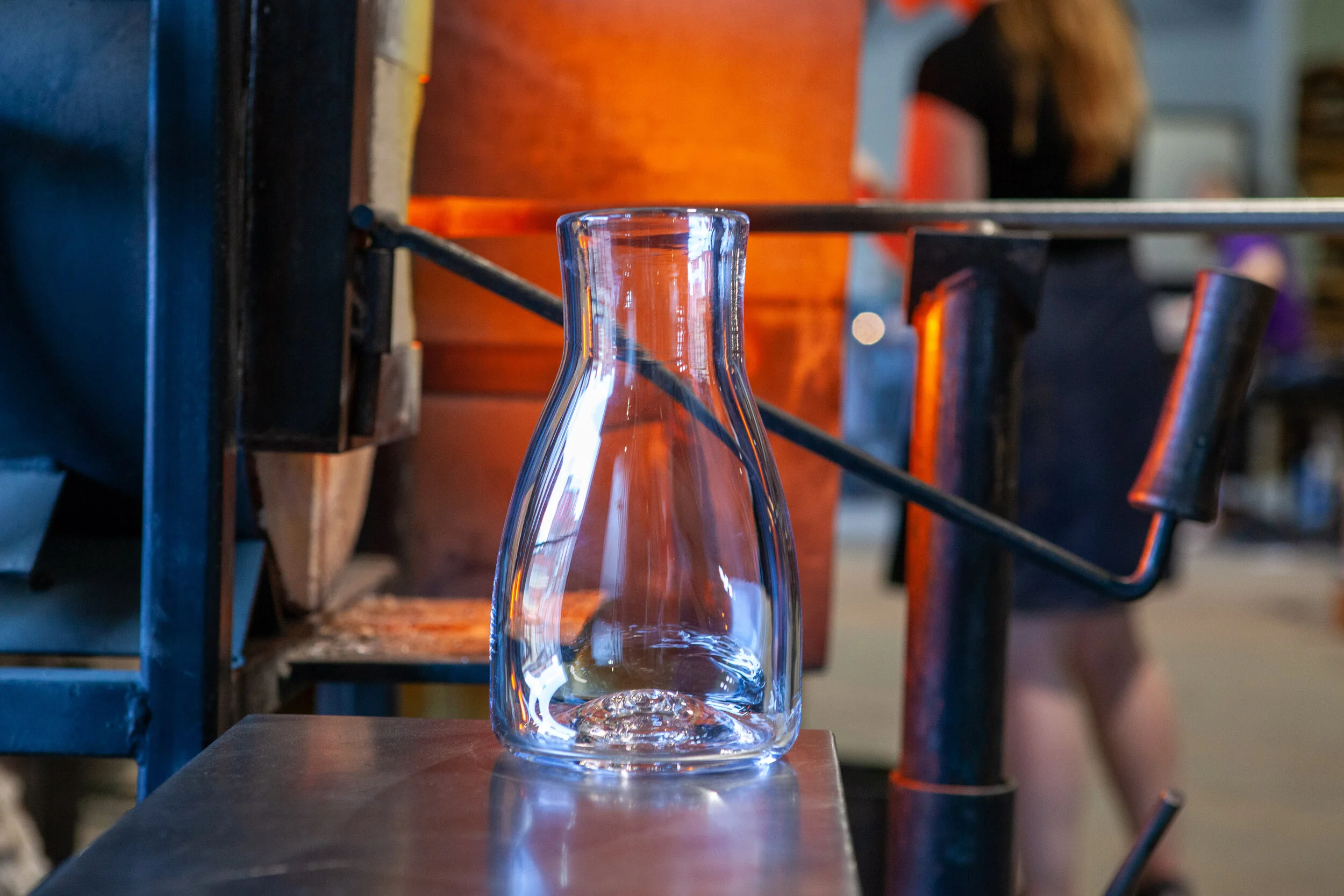 The AO Vase - Vermont made hand-blown vase in front of a glass blowing furnace