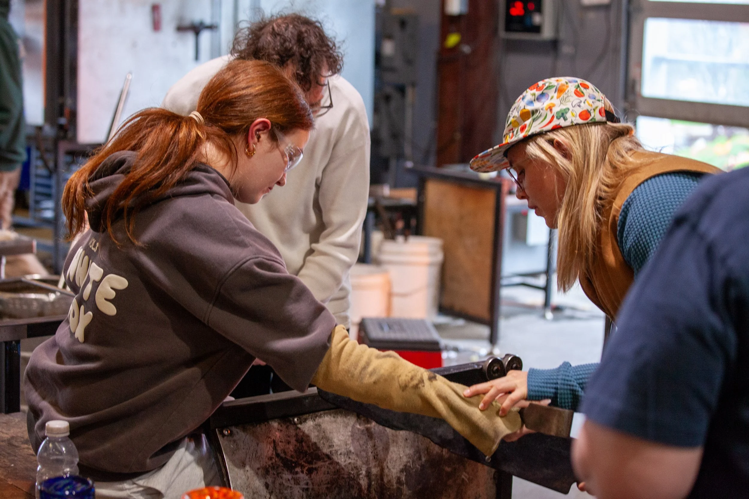 teaching a glass blowing class