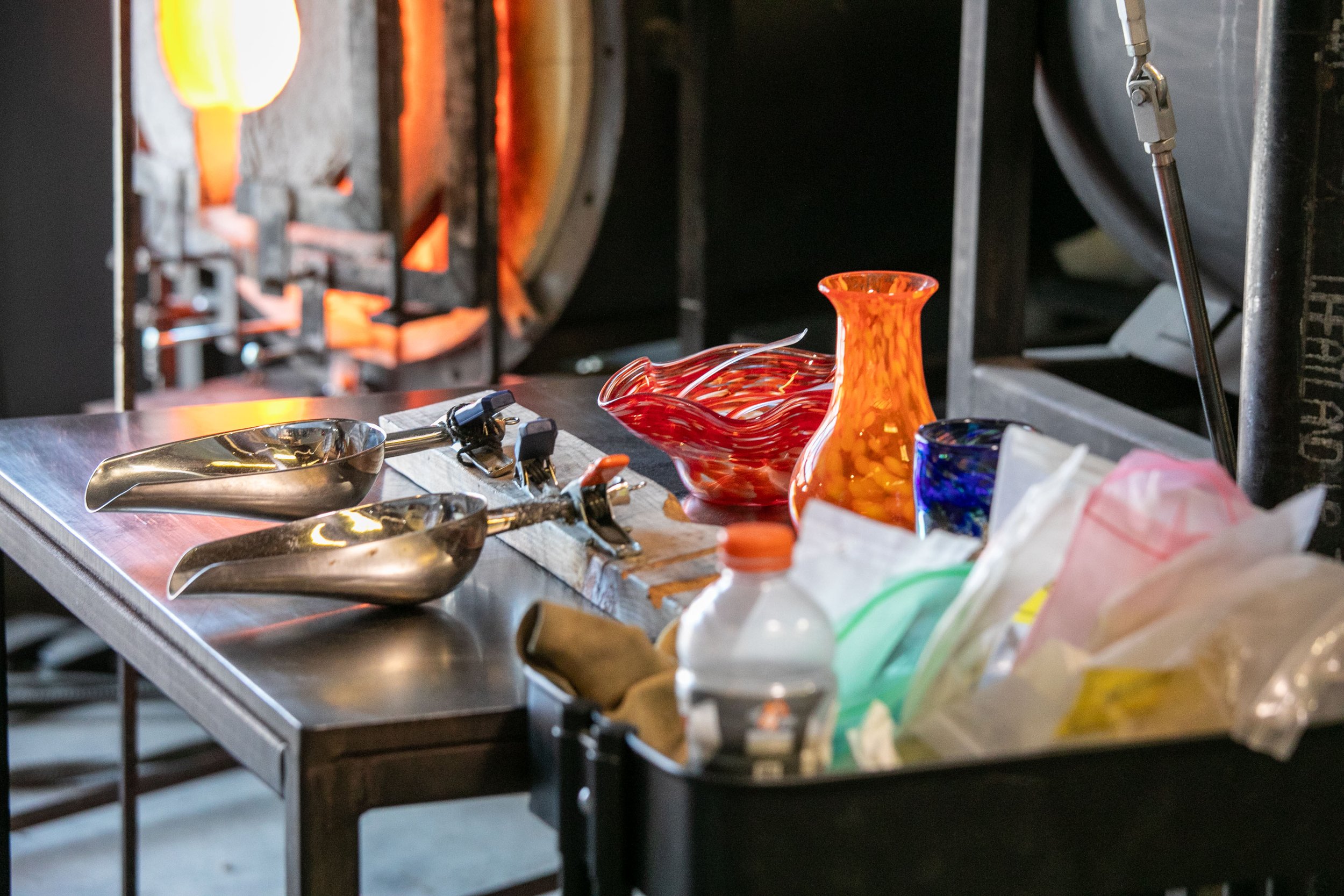 A glassblowing marver with glass colors set up to create glass for a glassblowing class.