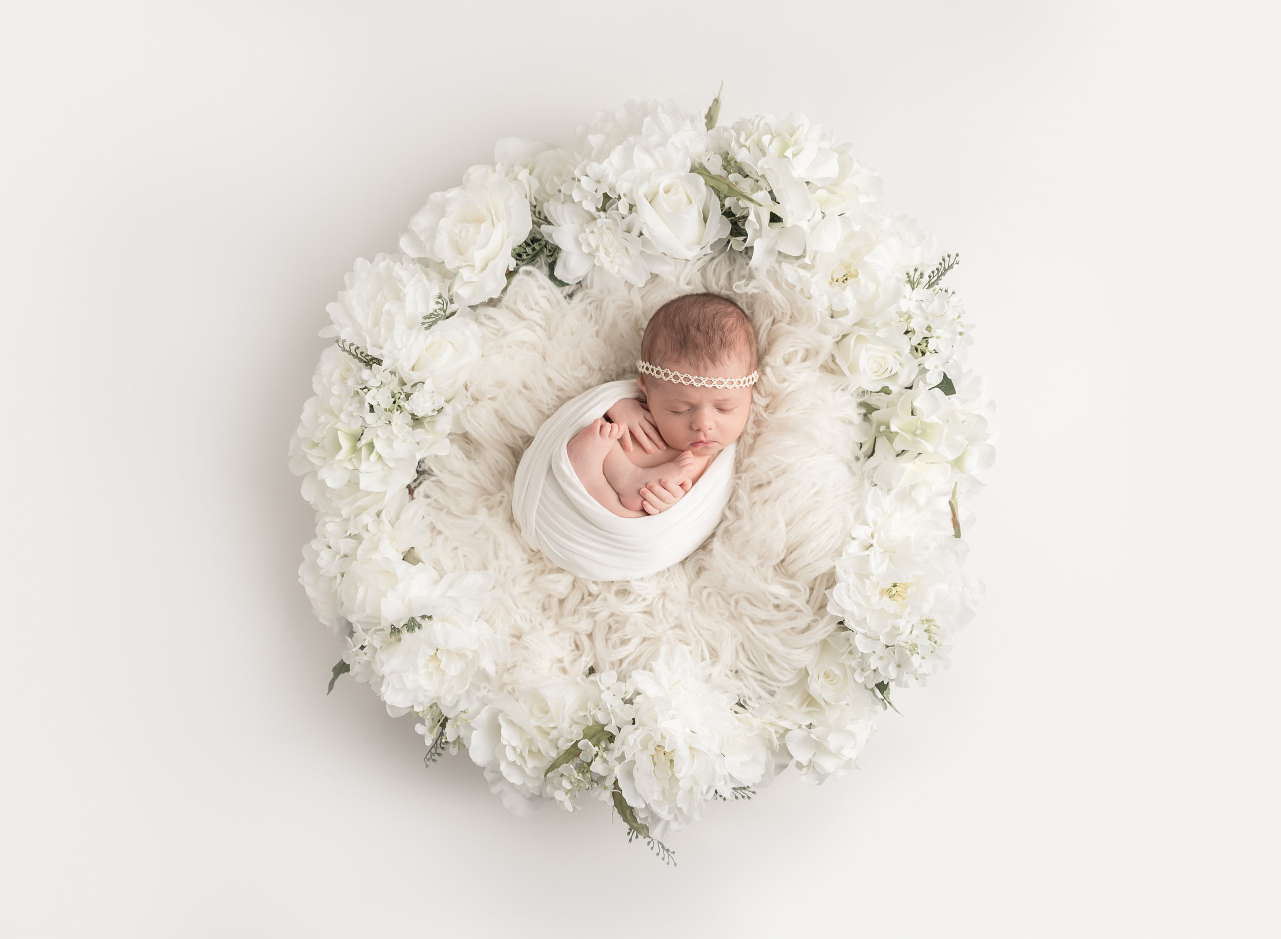 Newborn in Flower Basket