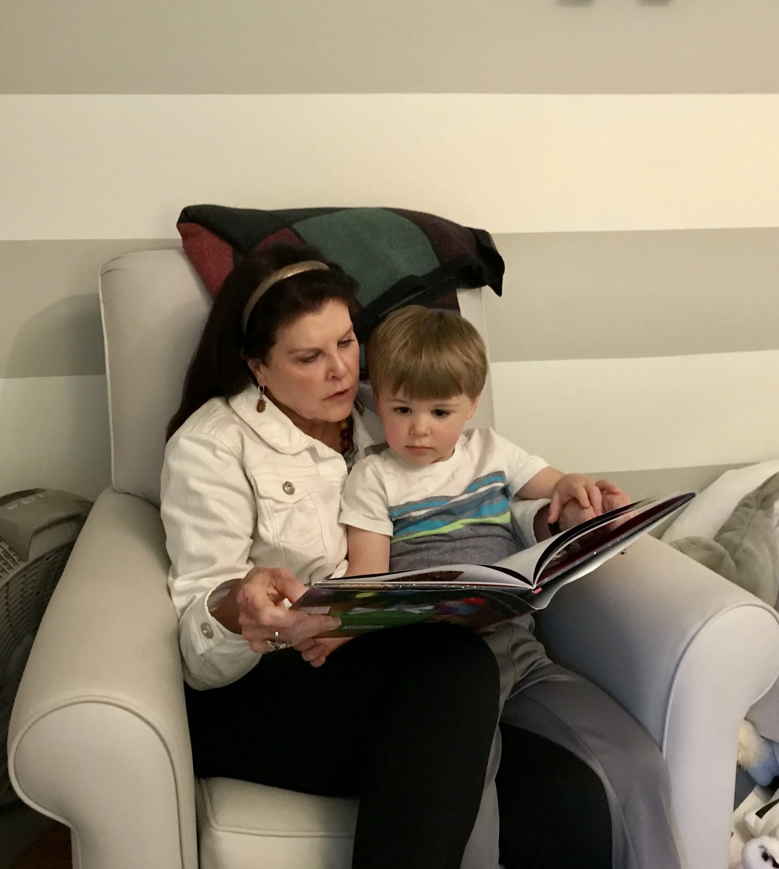 Susan reading a story to her grandson, Walker. 