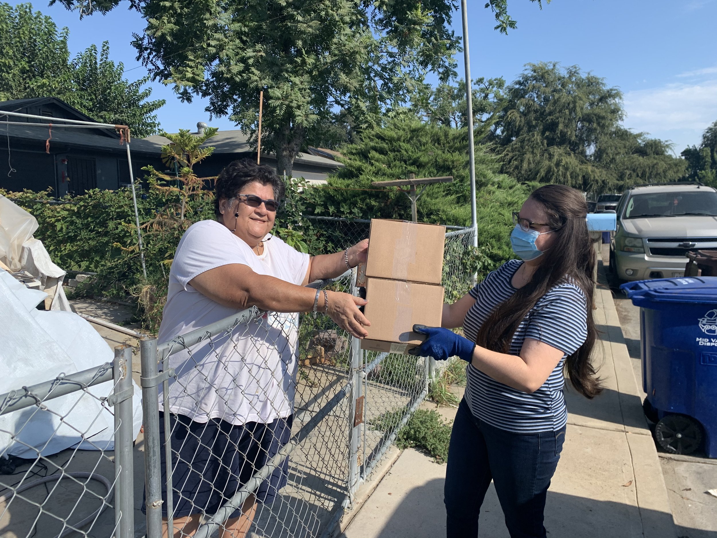 Yesenia (right) delivering meals to a local senior citizen..jpeg