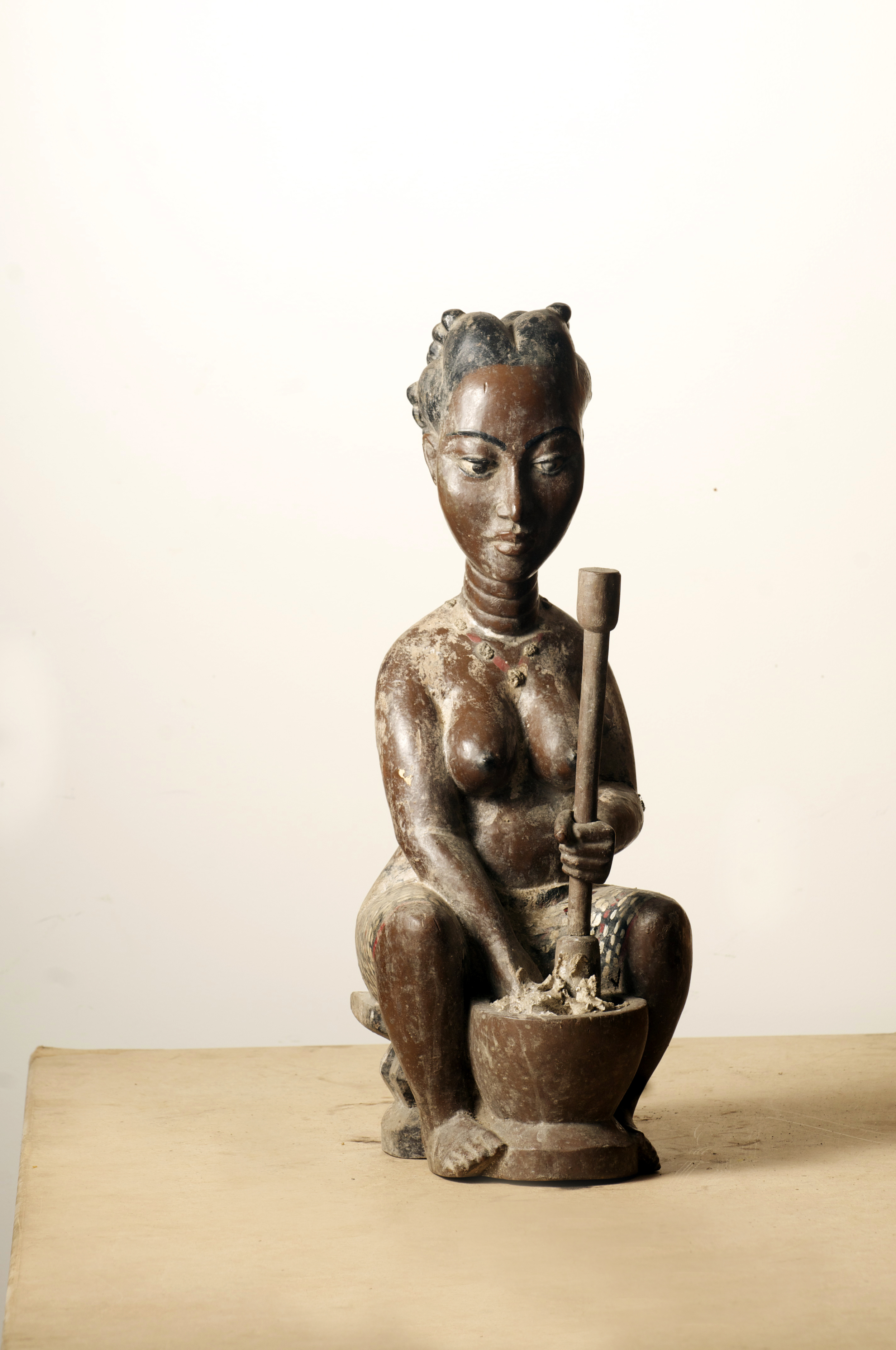 Anyi woman pounding figure. Cote Divoire. Height. 23.5 inch. Pp. $300.00.jpg