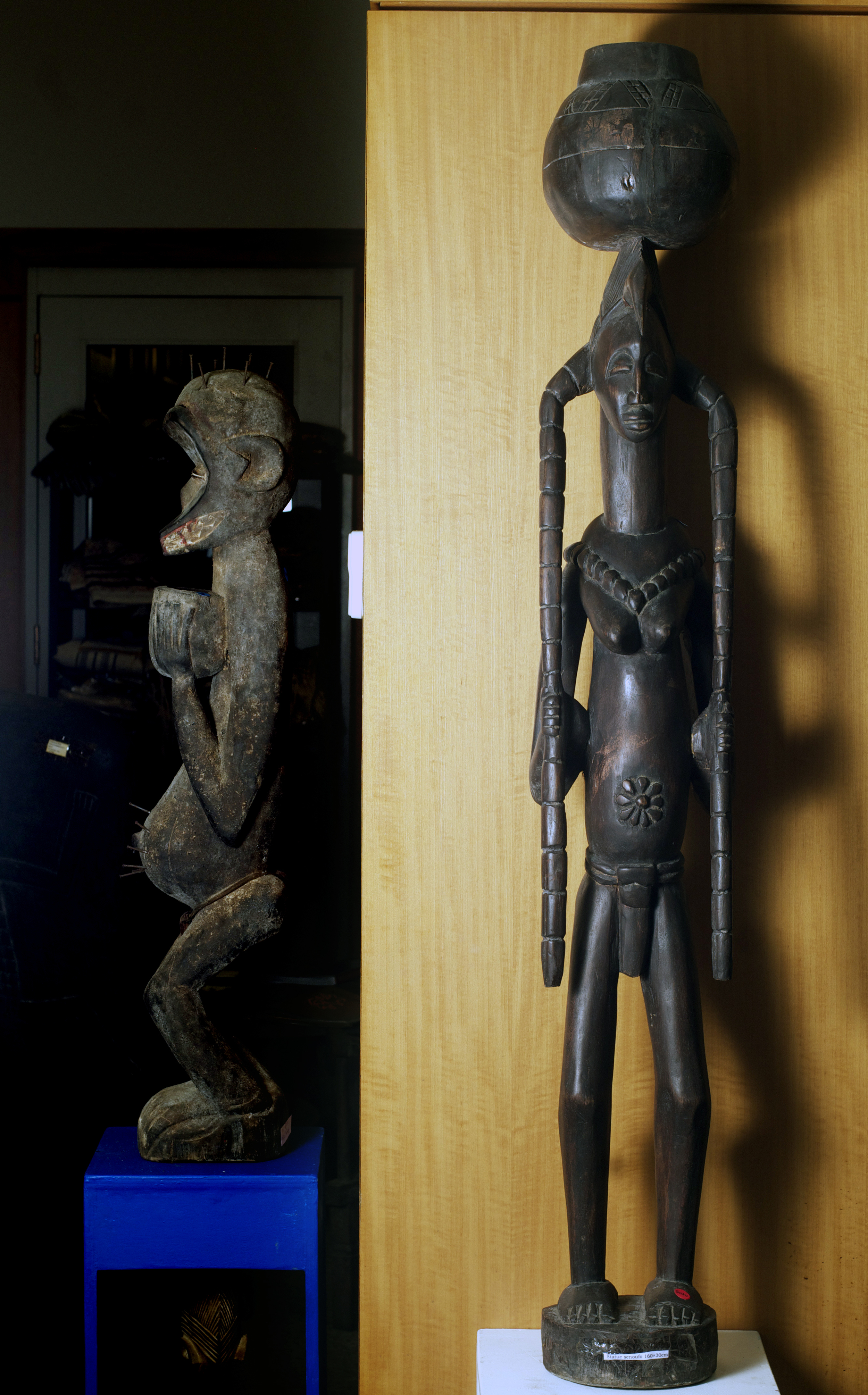 Senufo figure with pots, Cote D'Ivoire. Height 61.3 inch. Pp. $600.00.jpg