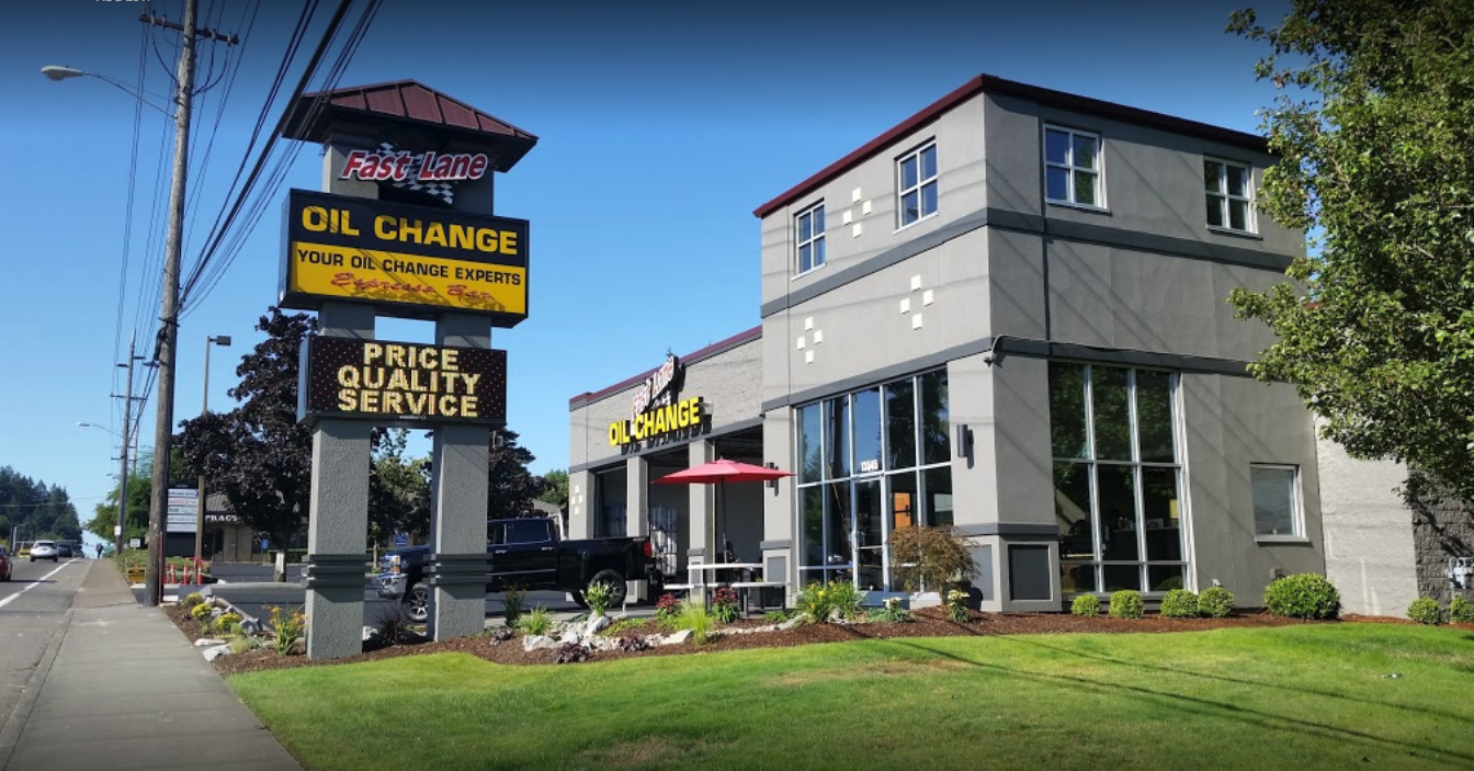 mechanic at Tigard Fast Lane Oil Change working on a car engine