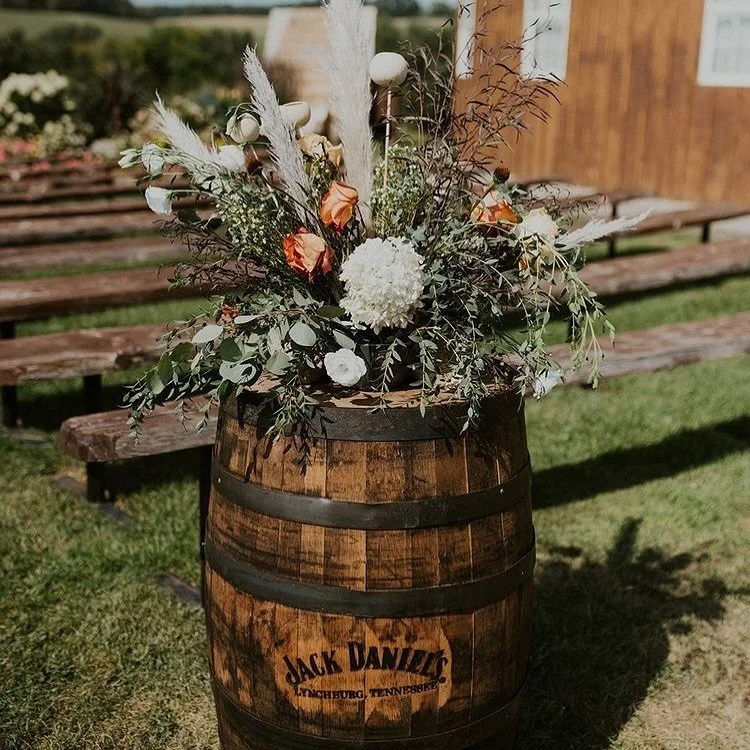 Whiskey barrels adorned with florals set the stage for a magical ceremony for Seth + Abby&rsquo;s wedding. 

Photography: @hollylabbe / Floral: @wyldstem