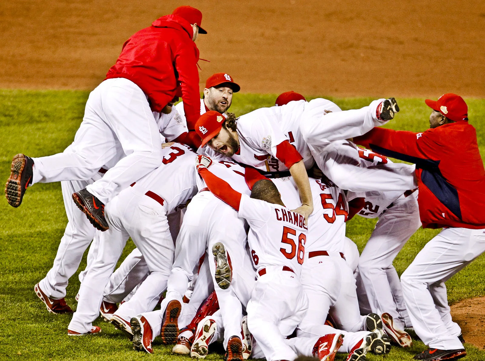  St. Louis Cardinals relief pitcher Lance Lynn&nbsp;jumps on the pile of teammates as they celebrate winning the World Series by defeating the Texas Rangers in Game 7 in St Louis, Mo., on&nbsp;October 28, 2011. 