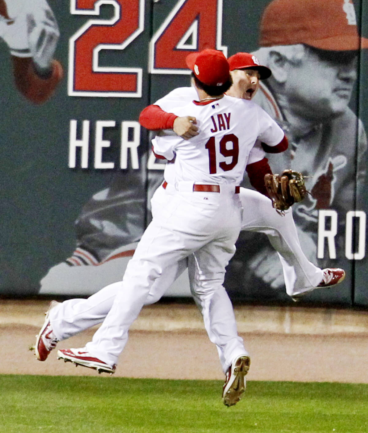  St. Louis Cardinals' Allen Craig and Jon Jay jump into each other's arms after defeating the Texas Rangers in Game 7 to win MLB's World Series baseball championship in St. Louis, Mo., on&nbsp;October 28, 2011. 