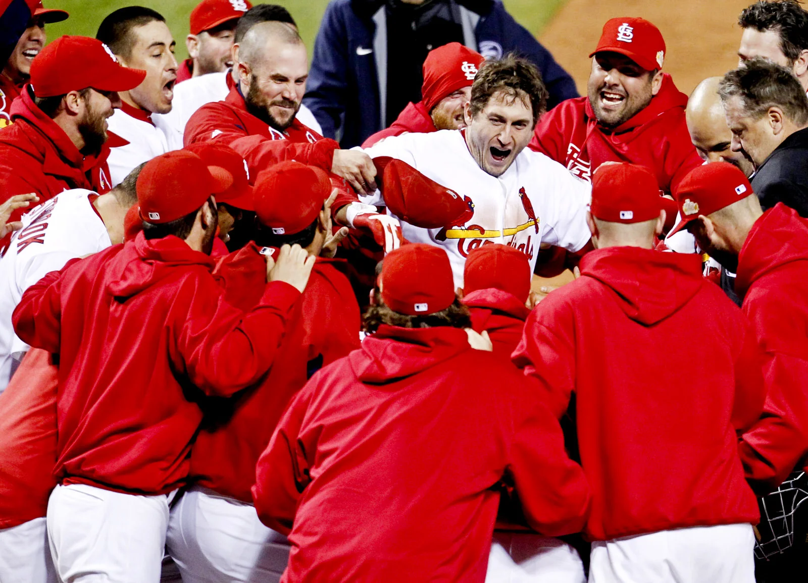  St.&nbsp;Louis Cardinals' David Freese steps on home plate surrounded by his teammates after hitting the game winning home run against the Texas Rangers in the eleventh inning of&nbsp;Game 6 of MLB's World Series baseball championship in St. Louis, 