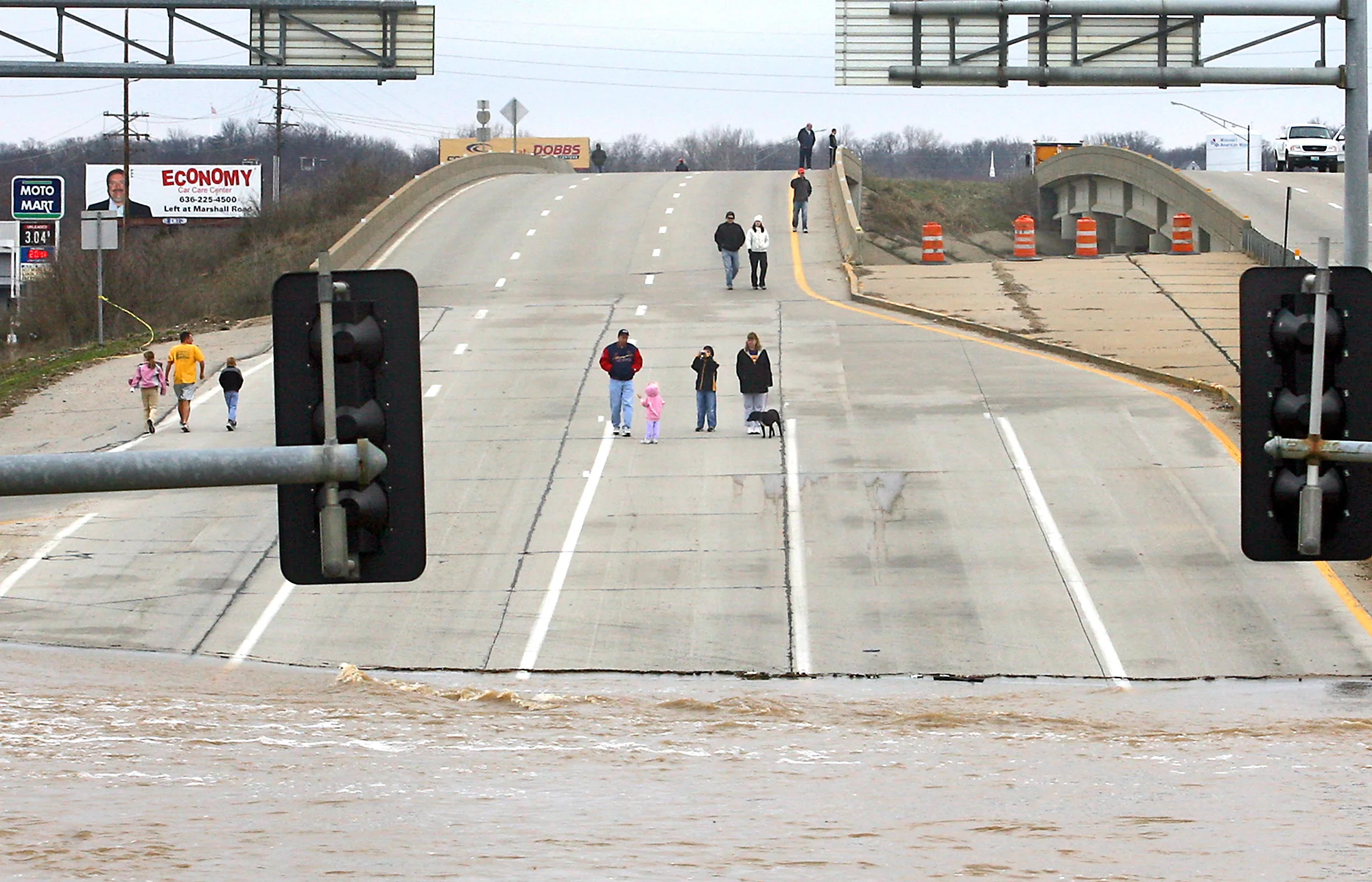  Sightseers look at the flooded section of M0-141 at the intersection of I-44 in Valley Park, Mo., on Saturday, March 22, 2008. Heavy flooding caused much damage to the area.