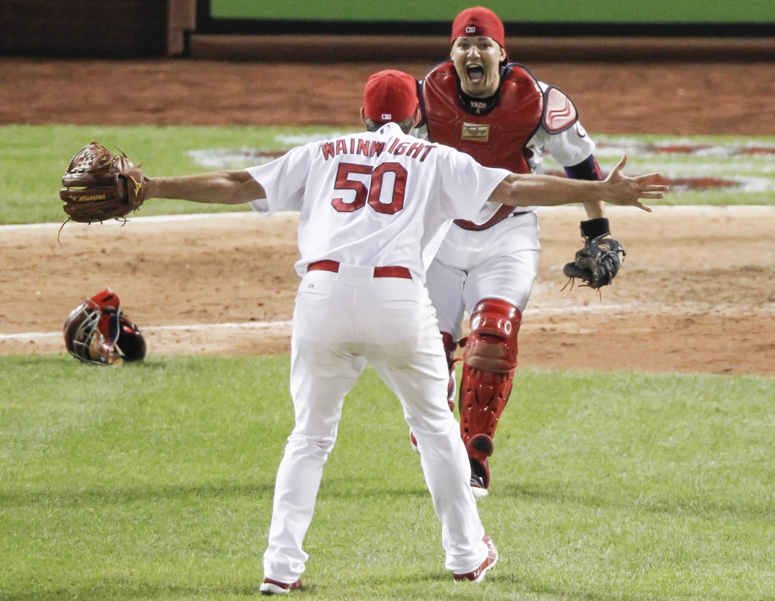  St. Louis Cardinals&nbsp;pitcher Adam Wainwright celebrates with catcher Yadier Molina after Wainwright struck out Pittsburgh Pirates' Pedro Alvarez in the ninth inning to win Game 5 of a National League baseball division series on October 9, 2013. 