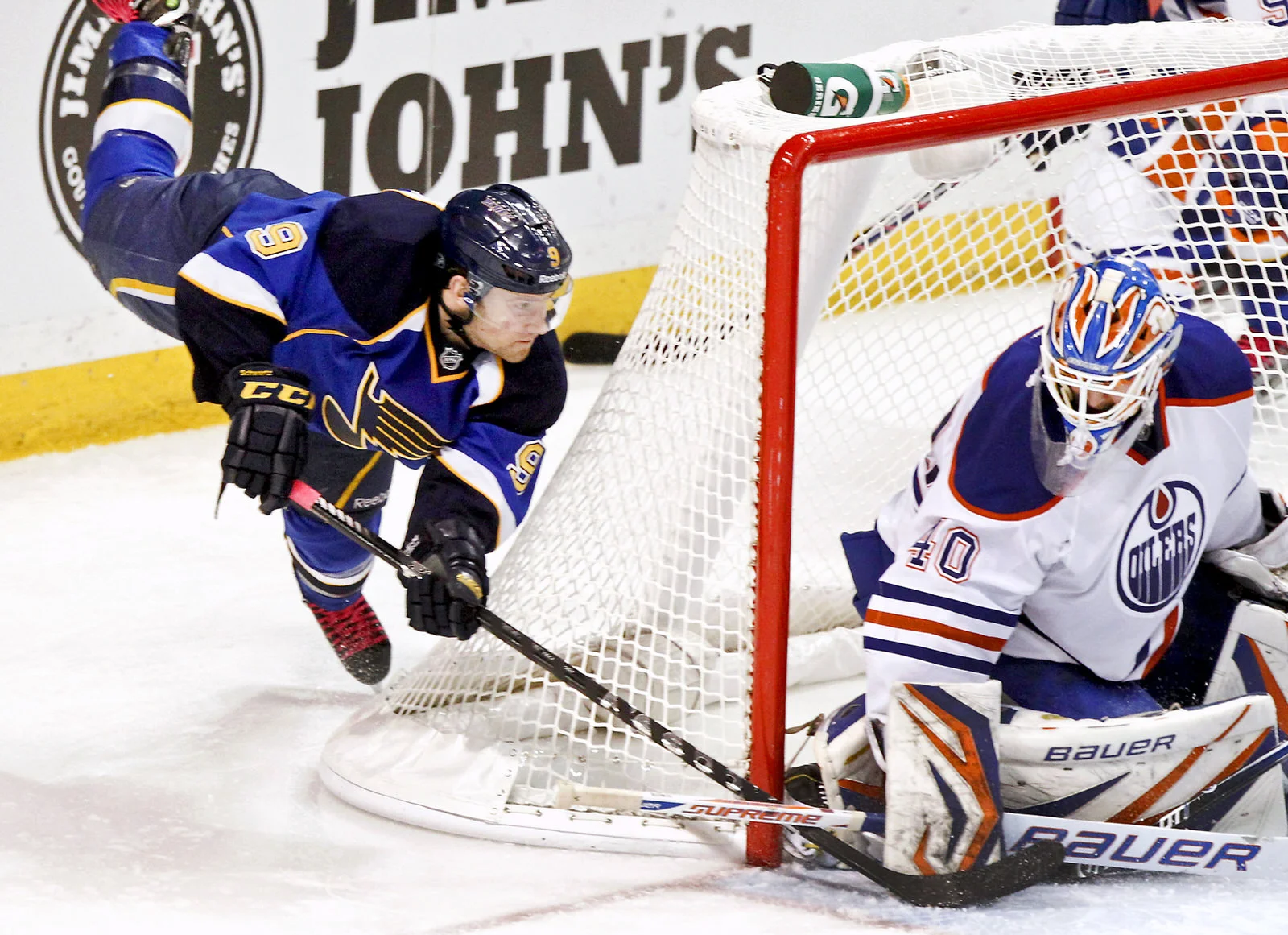  St. Louis Blues Jaden Schwartz takes a wrap-around shot against Edmonton Oilers goalie Devan Dubnyk during the third period of their NHL hockey game in St. Louis, Mo., on March 1, 2013. 