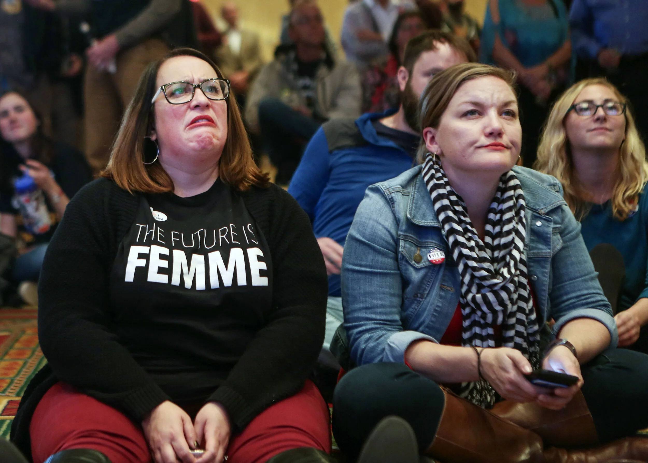 Vicky Dean, left, and Nyrinda Grantham, right, supporters of Democratic U.S. Senator Claire McCaskill react to election results in St. Louis, Mo., Tuesday, Nov. 6, 2018. 