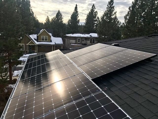 A little snow never hurt anyone! Given that solar panels are made of glass, tilted at an angle, and strategically placed in sunny spots, the snow will melt off an array much faster than the rest of the roof and have you back producing power in no tim