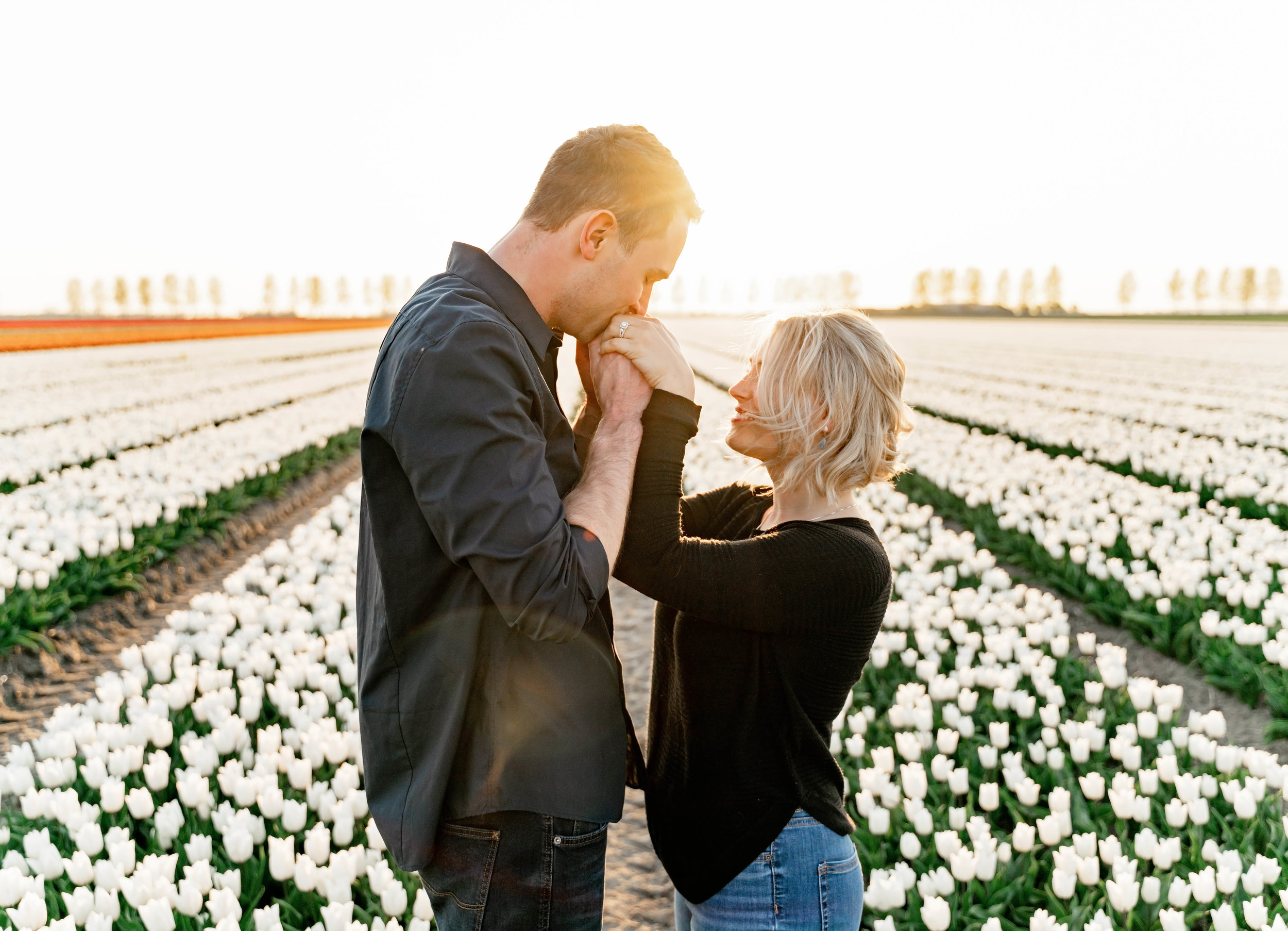  engagement session having a destination foto shoot with a couple in the Netherlands in the tulip fields by kmc photographer sarah havens 
