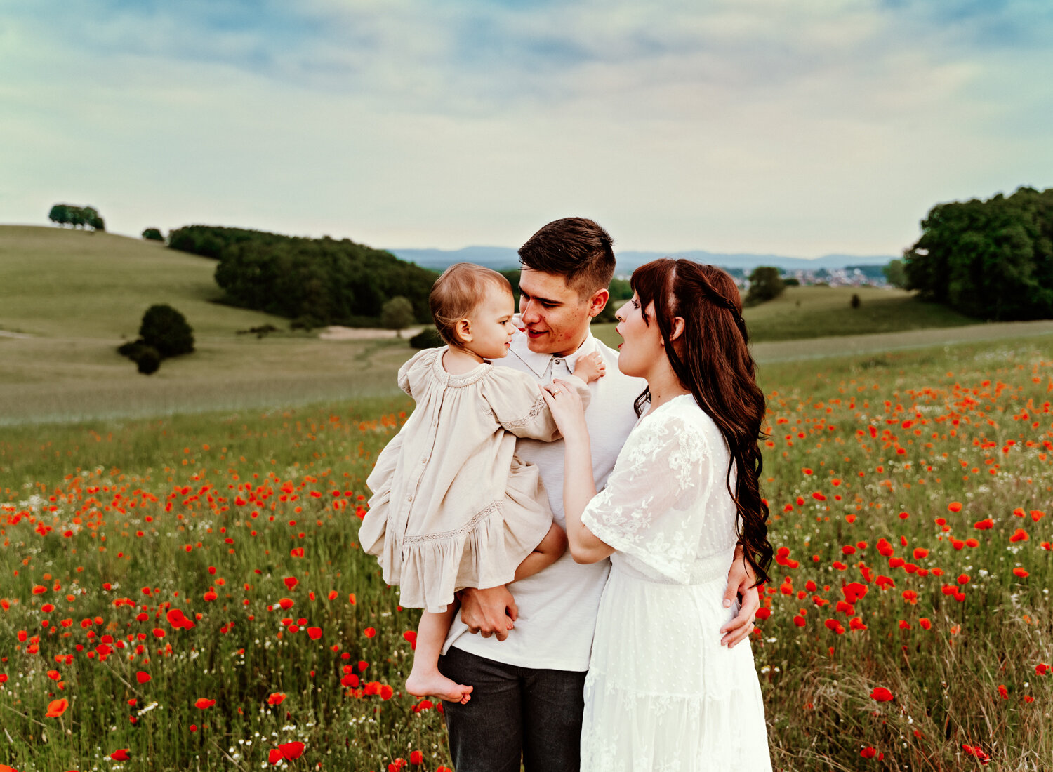 young-family-with-baby-girl-palying-in-poppy-flower-field-in-ramstein-family-photographer-sarah-havens-kaiserslautern-germany (1).jpg
