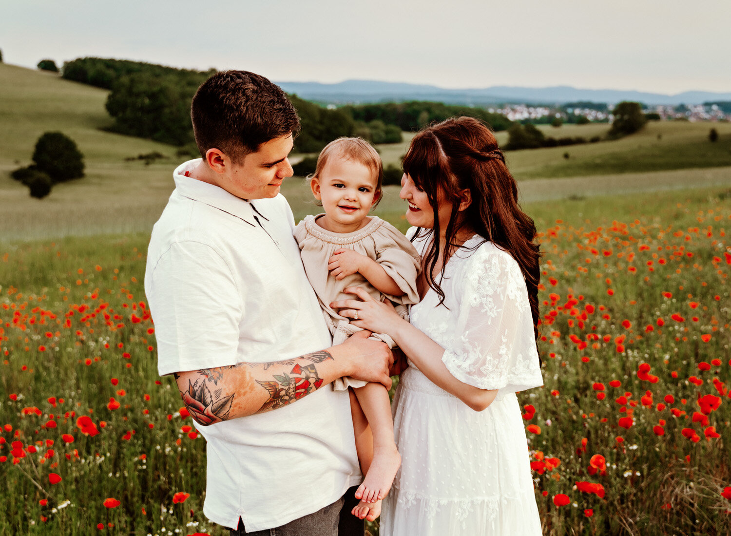 young-family-with-baby-girl-palying-in-poppy-flower-field-in-ramstein-family-photographer-sarah-havens-kaiserslautern-germany (4).jpg