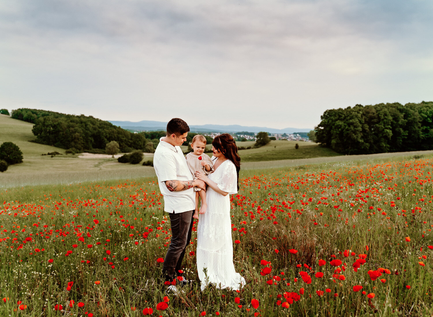 young-family-with-baby-girl-palying-in-poppy-flower-field-in-ramstein-family-photographer-sarah-havens-kaiserslautern-germany (5).jpg