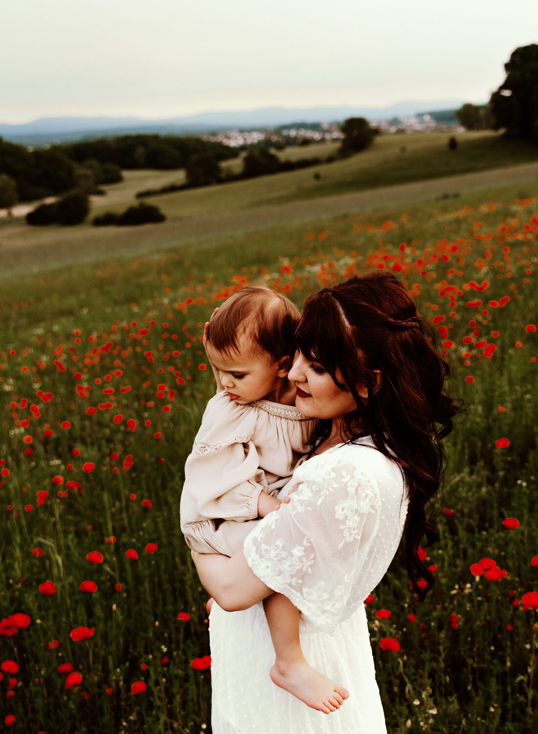 young-family-with-baby-girl-palying-in-poppy-flower-field-in-ramstein-family-photographer-sarah-havens-kaiserslautern-germany (10).jpg