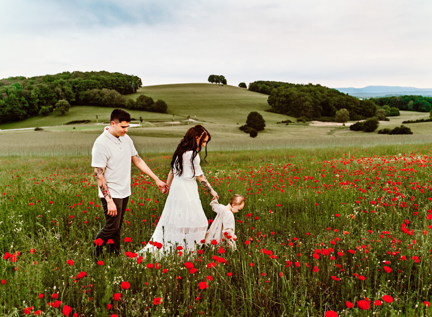 young-family-with-baby-girl-palying-in-poppy-flower-field-in-ramstein-family-photographer-sarah-havens-kaiserslautern-germany (12).jpg