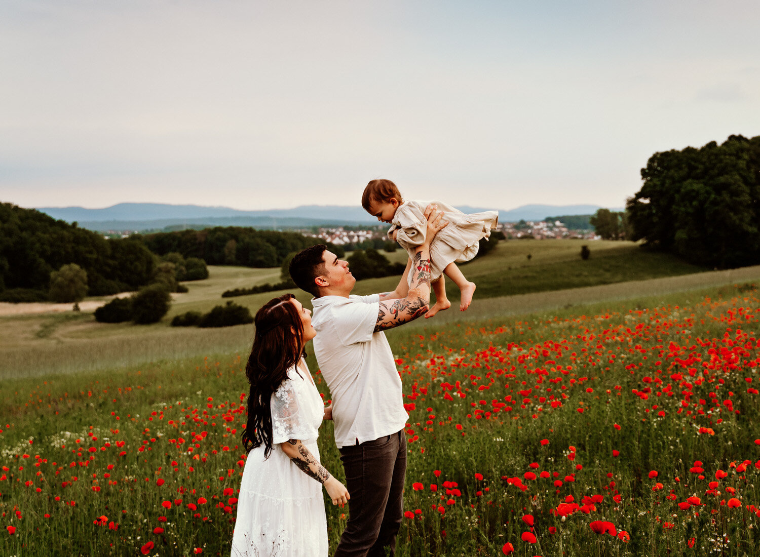 young-family-with-baby-girl-palying-in-poppy-flower-field-in-ramstein-family-photographer-sarah-havens-kaiserslautern-germany (14).jpg