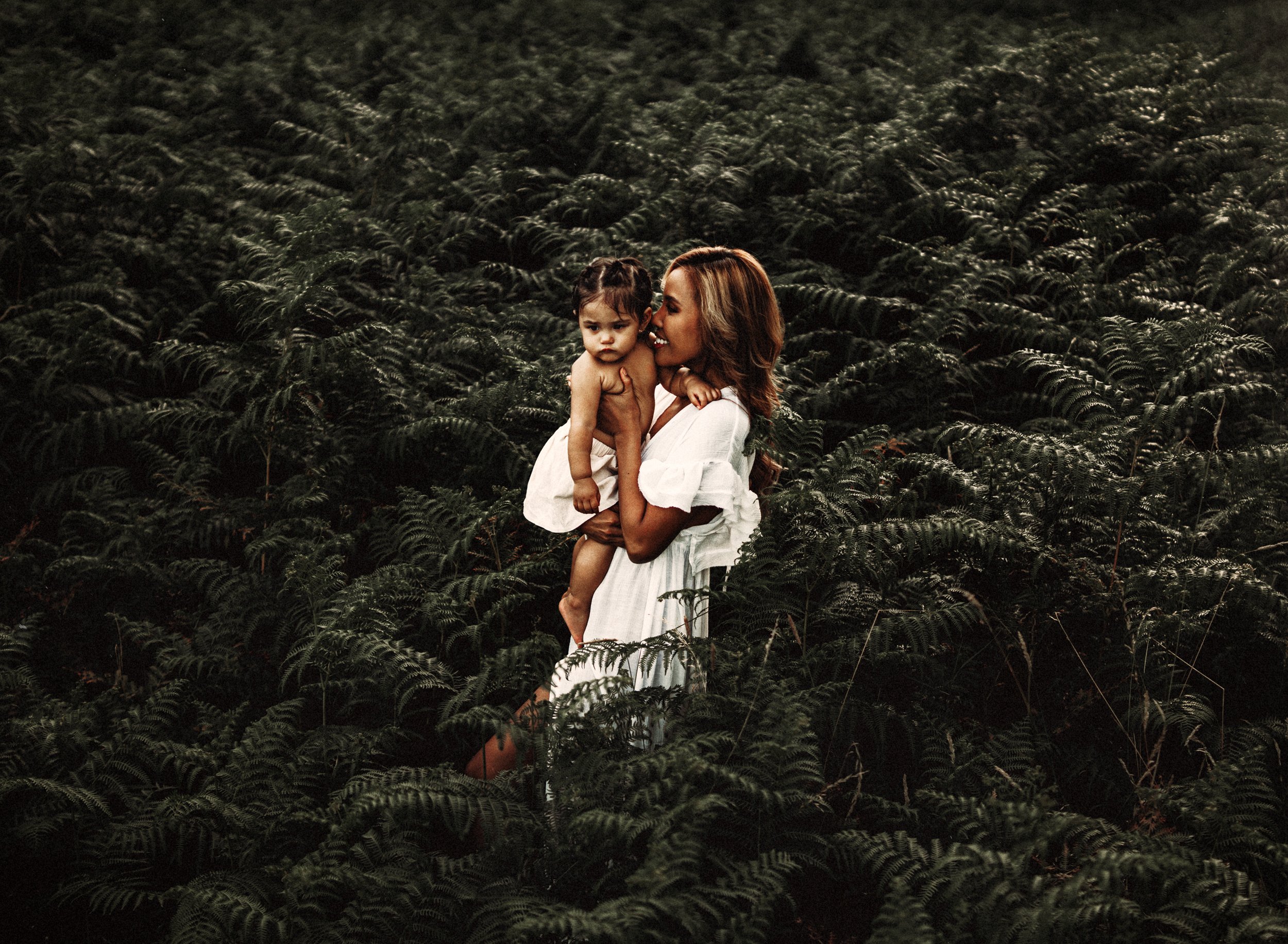 emotive-motherhood-photo-session-with-mother-and-daughter-in-a-patch-of-ferns-at-sunset-in-landtuhl-kmc-germany (2).jpg