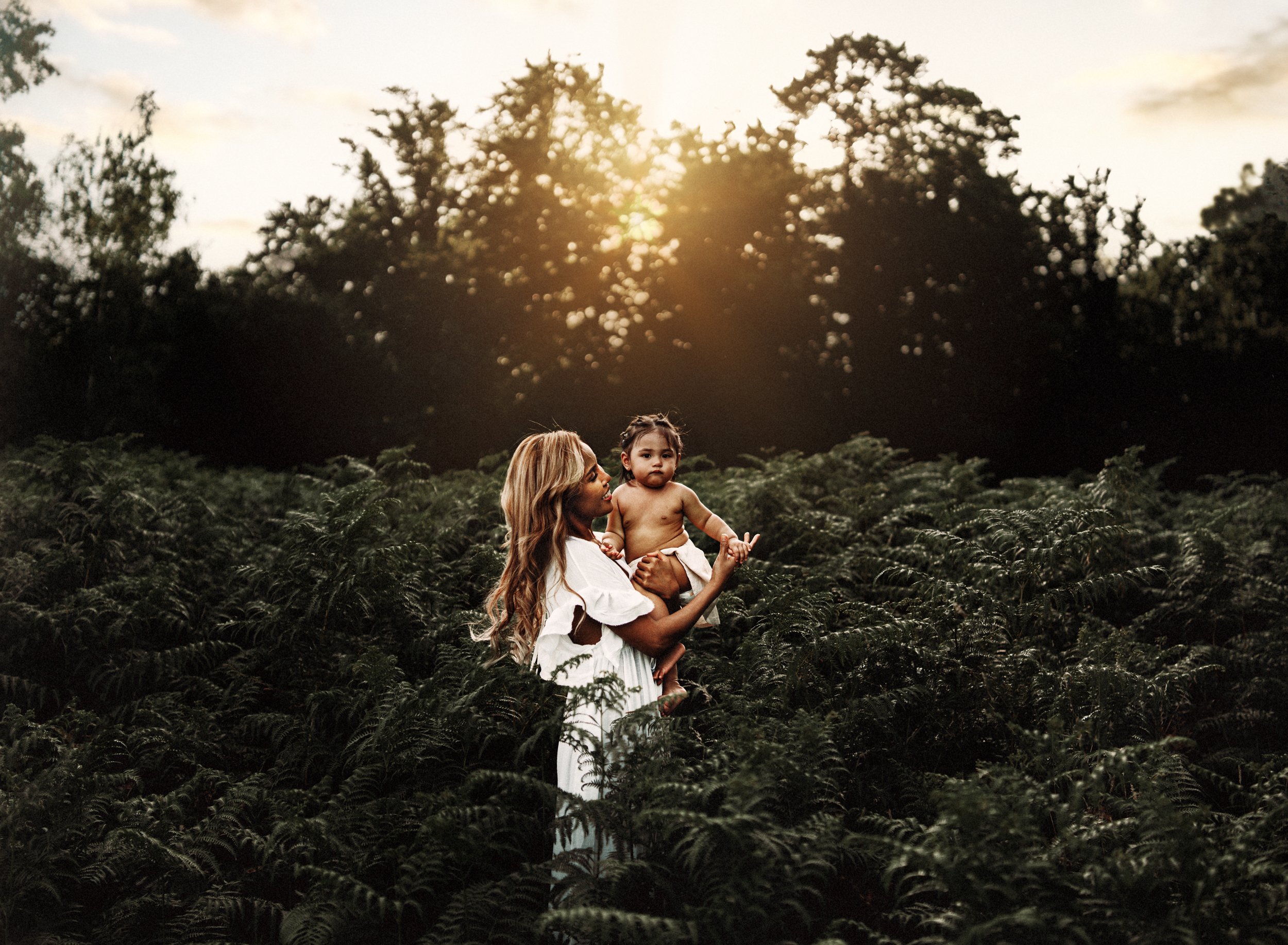 emotive-motherhood-photo-session-with-mother-and-daughter-in-a-patch-of-ferns-at-sunset-in-landtuhl-kmc-germany (3).jpg