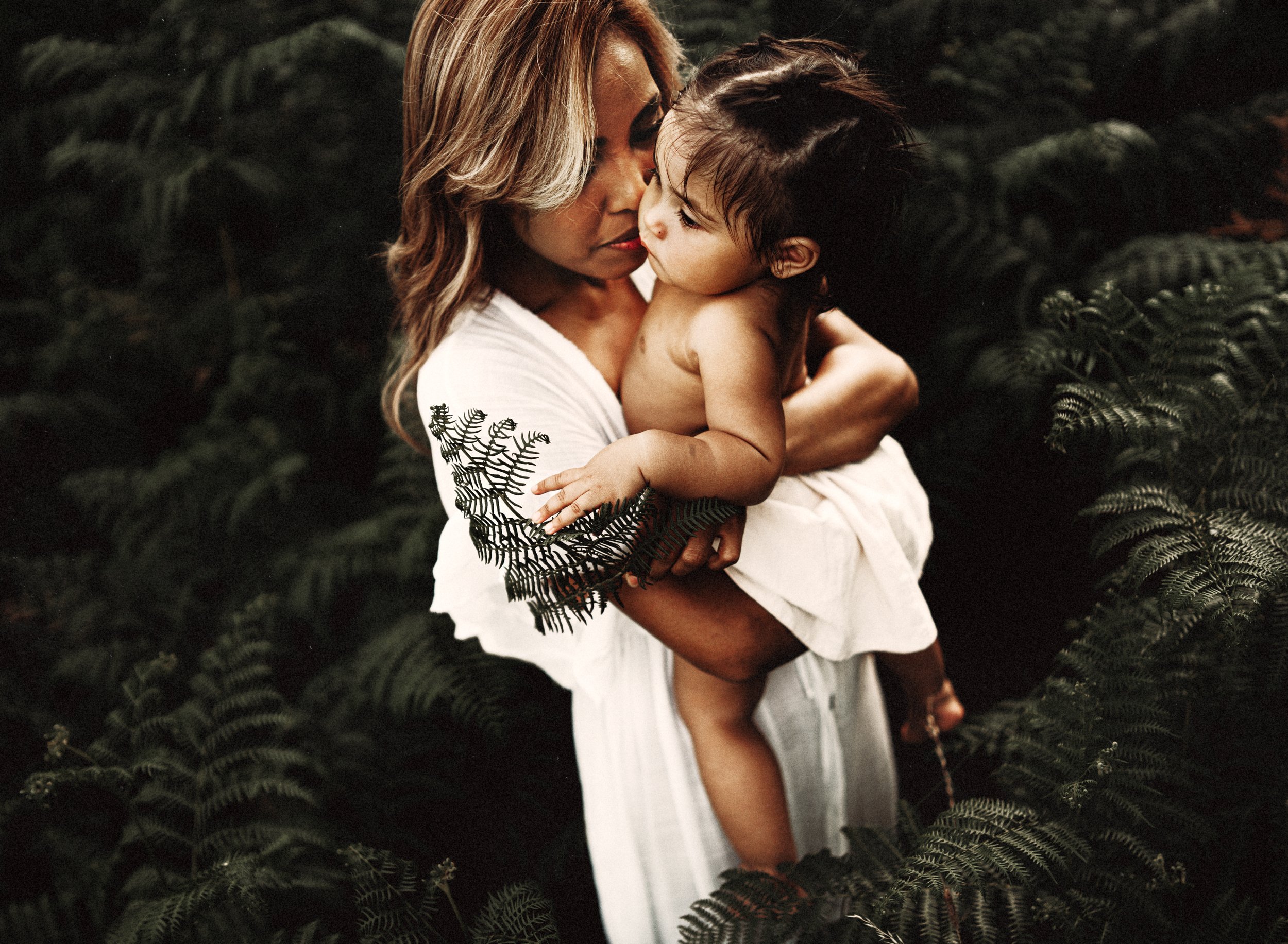 emotive-motherhood-photo-session-with-mother-and-daughter-in-a-patch-of-ferns-at-sunset-in-landtuhl-kmc-germany (4).jpg