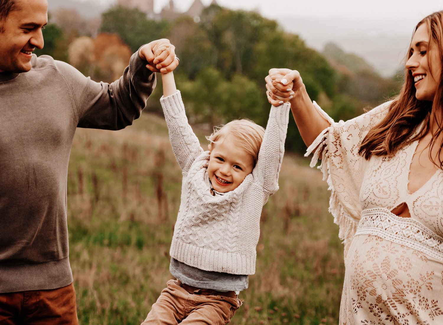 ramstein-family-of-three-with-young-boy-playing-in-the-fieds-by-lichtenebrg-castle-in-germany-by-kmc-photographer-sarah-havens.jpg