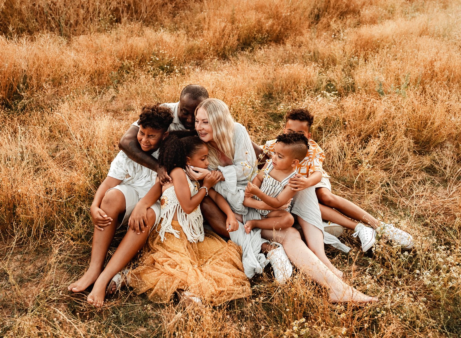 emotive-storytelling-summer-session-of-young-mixed-family-with-young-kids-at-sunset-in-german-country-side-in-ramstein-kmc-by-sarah-havens (7).jpg