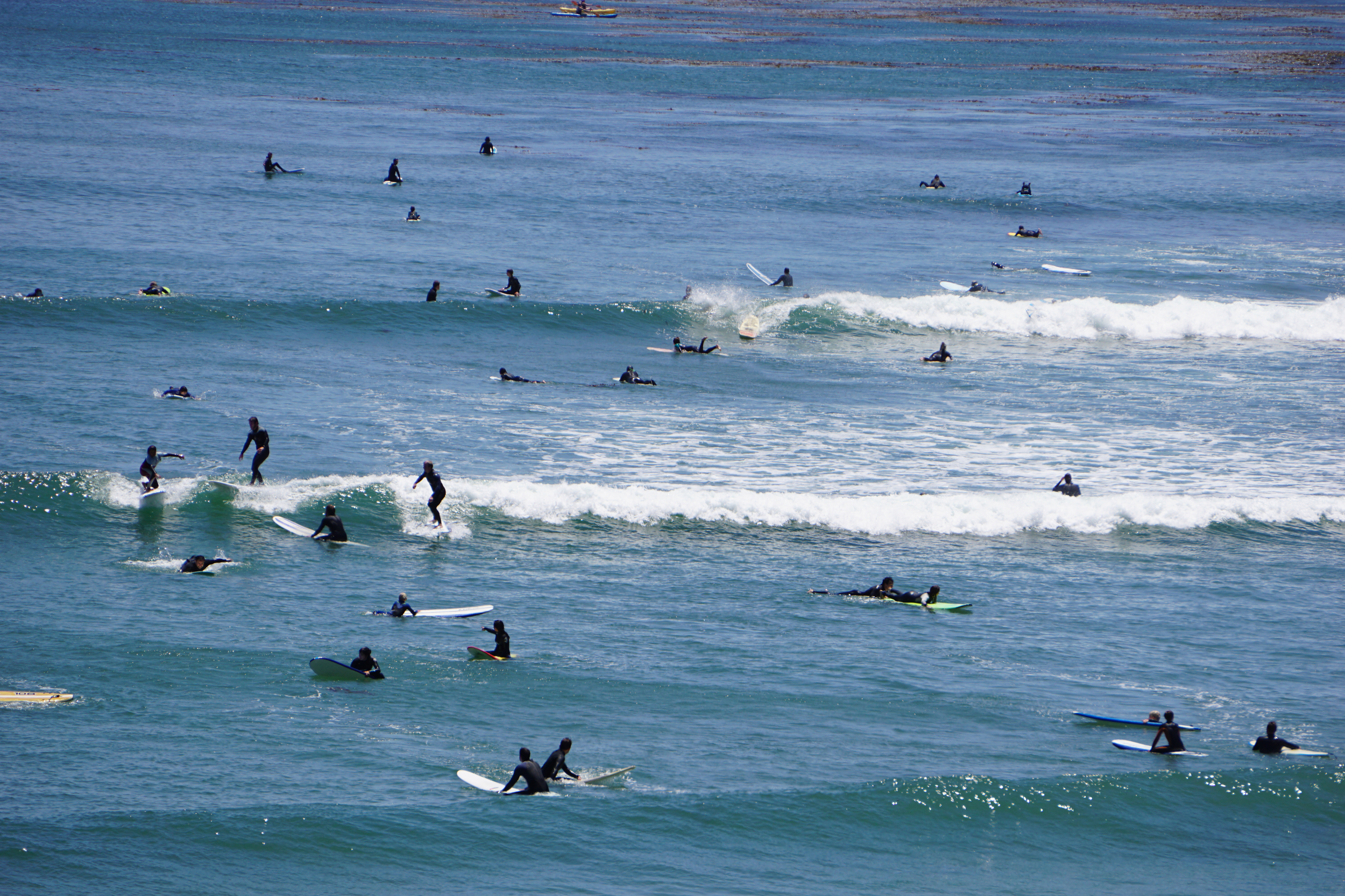 All the surfers in the bright blue sea