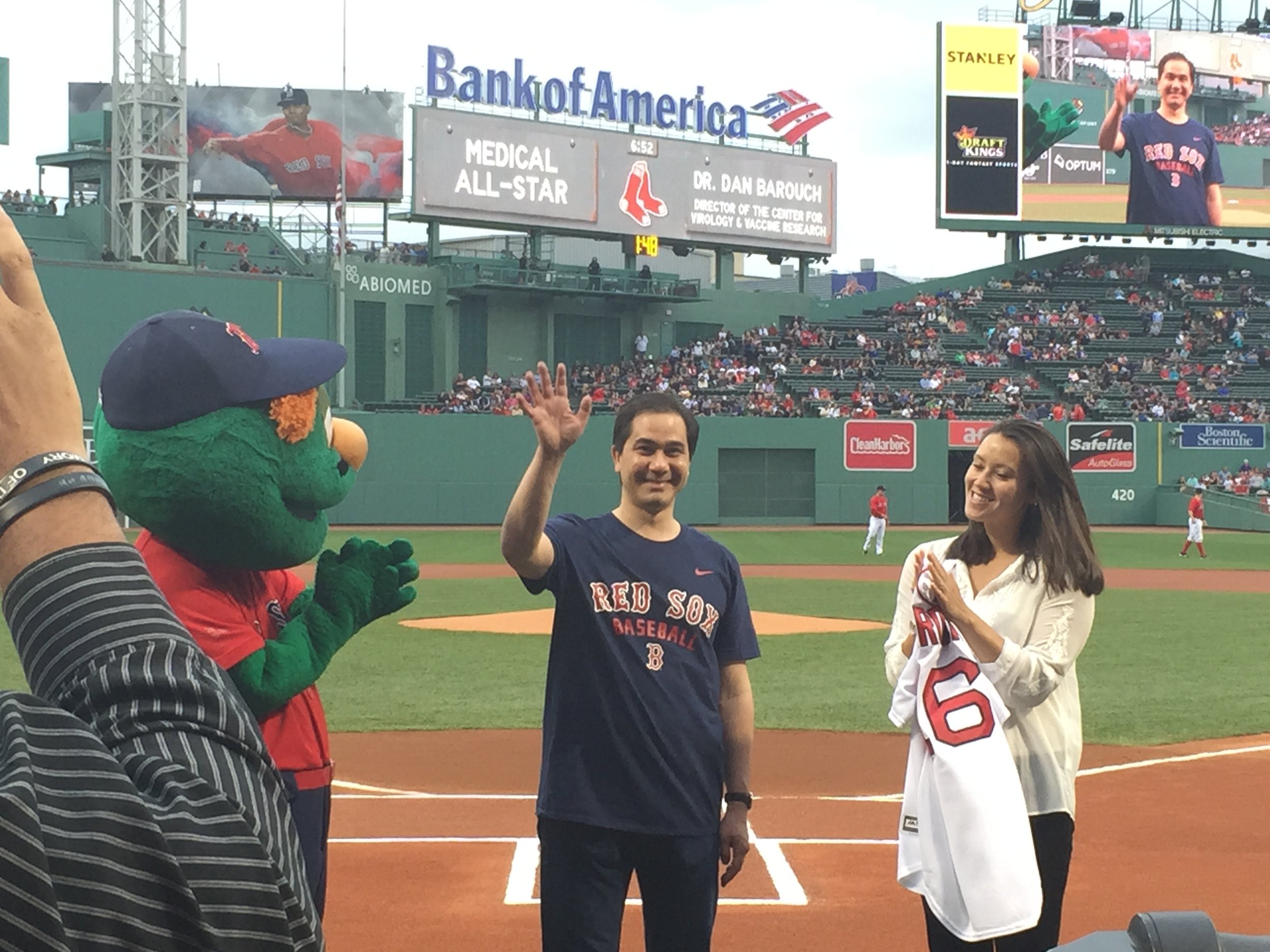 A Red Sox official introduces Dr. Dan Barouch, being honored for his leadership in HIV research.