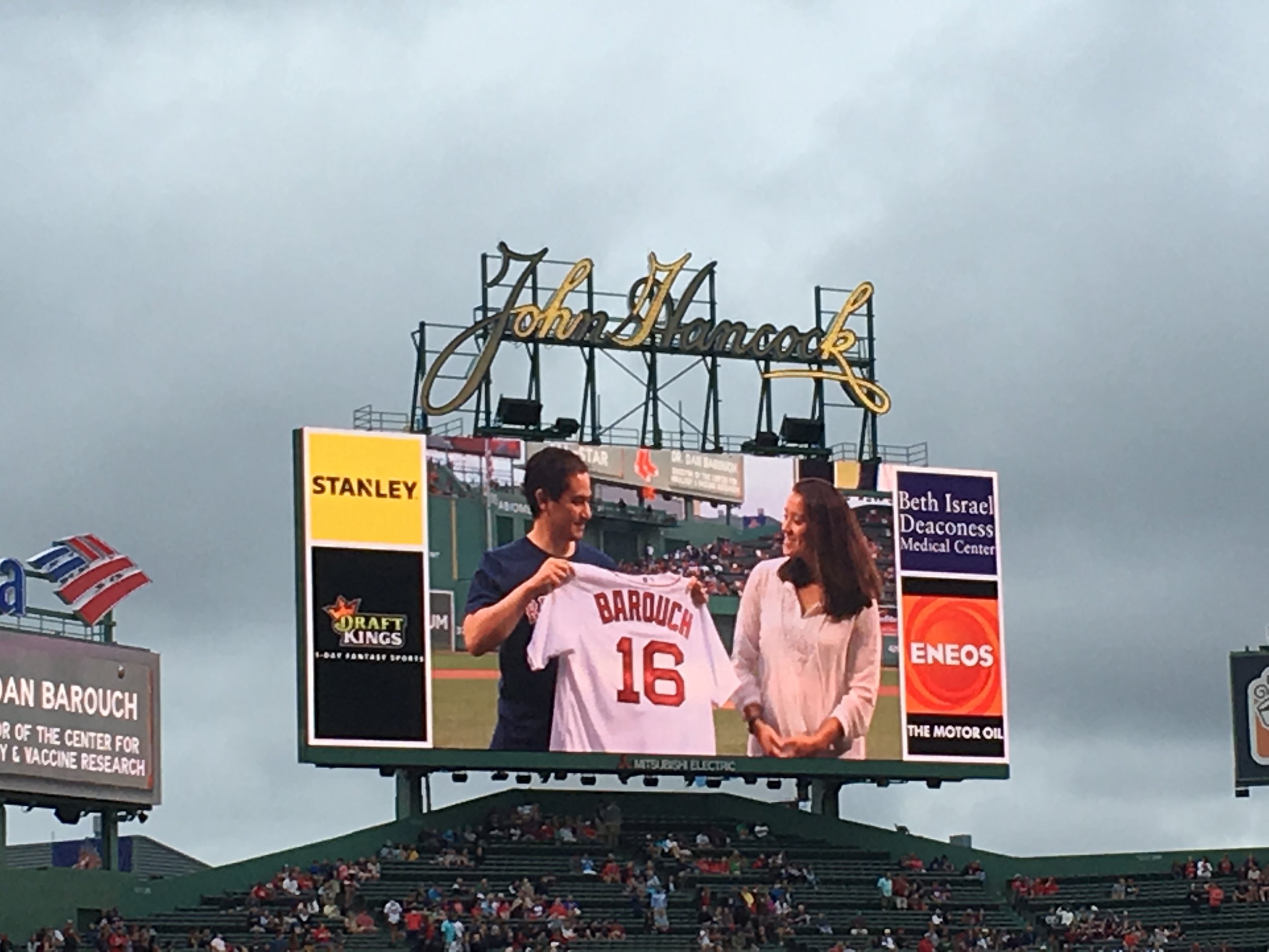 Dr. Barouch being given an honorary Red Sox jersey while being recognized as a Medical All-Star.