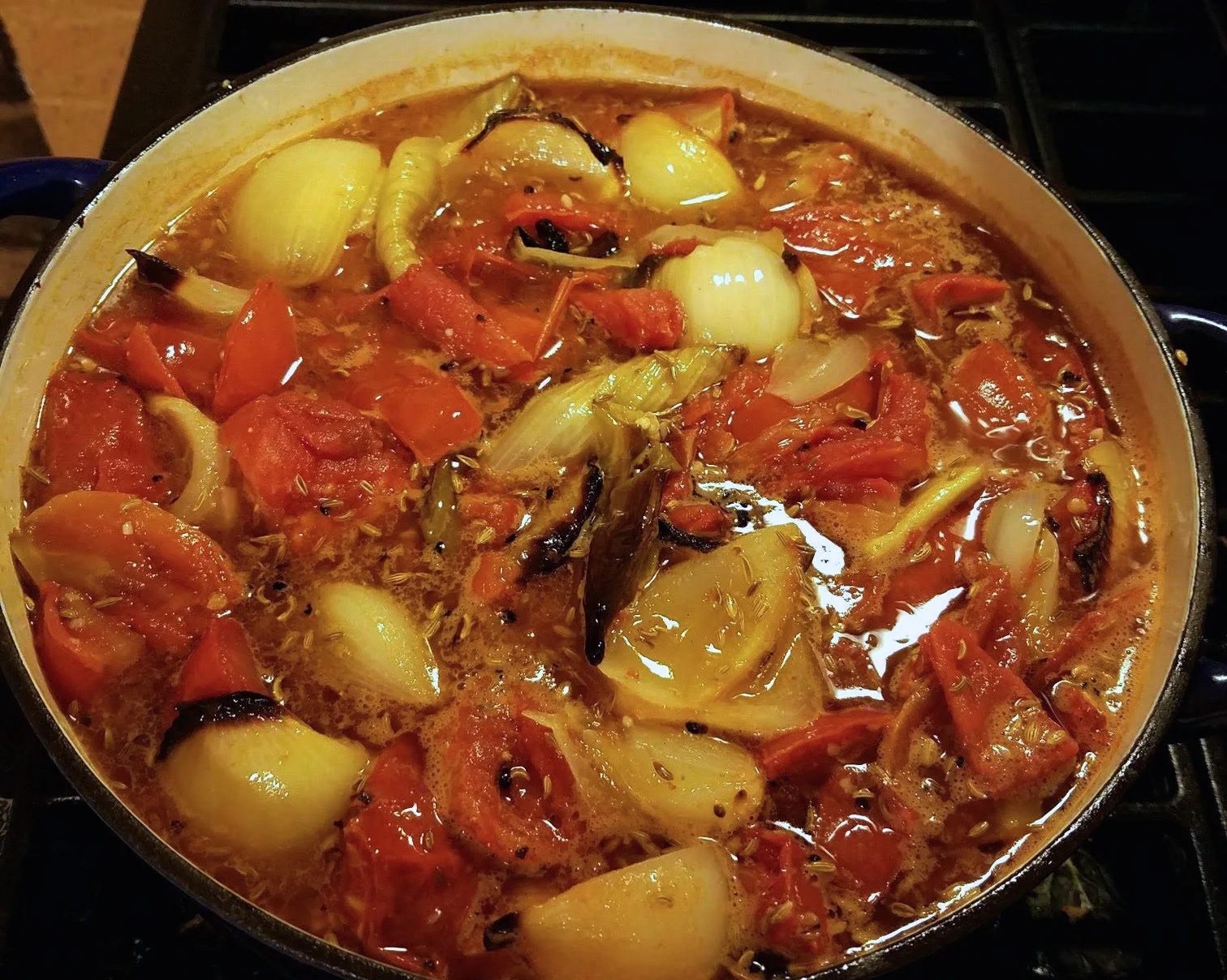 Vegetables and stock simmering in the pot.