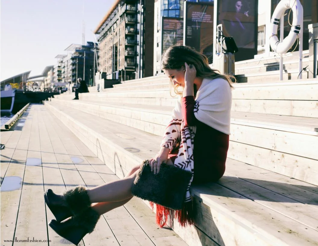 Noelle Lynne photographed by Nicholas Counts in Sentrum, Oslo.&nbsp;Above:&nbsp;Alpine Blanket Scarf by Solosix, Dress by Free People,&nbsp;&nbsp;Faux Fur by Restoration Warehouse, and Faux Fur Shoes from Vince Camuto.