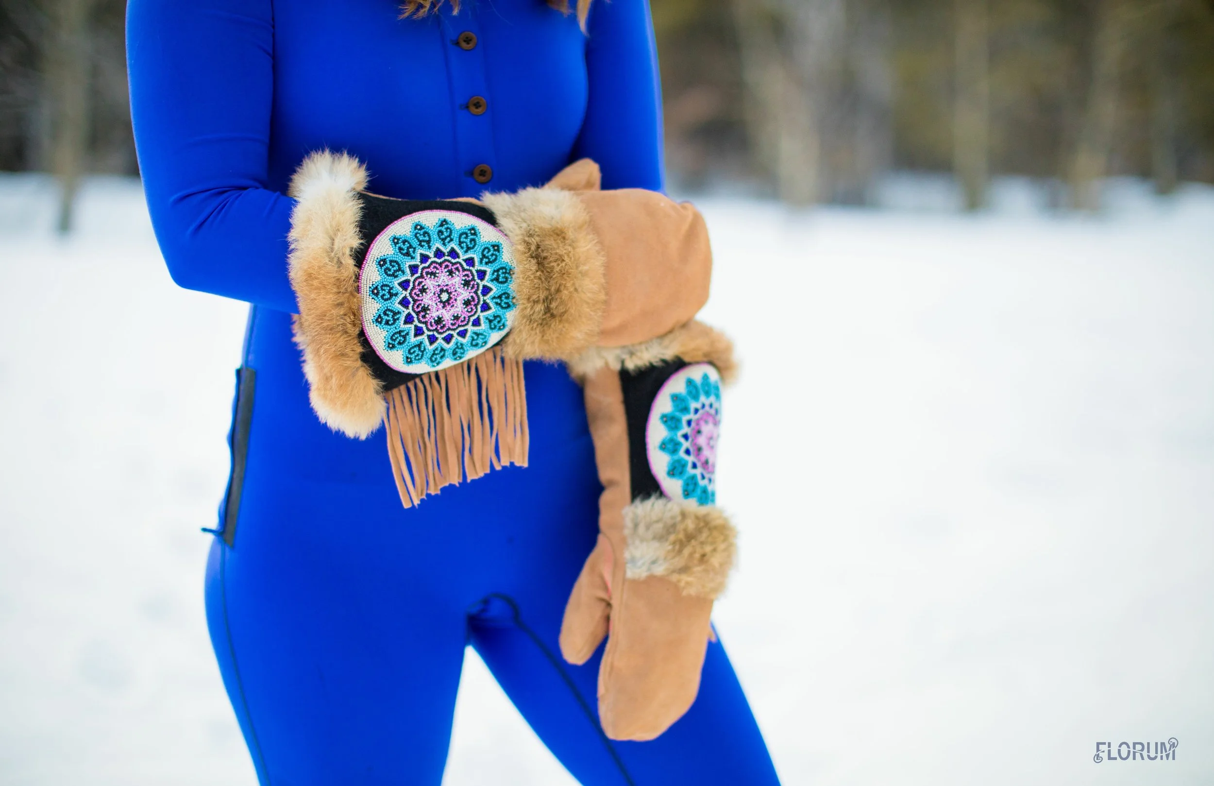 park handcrafted long cuff fringe leather fur mittens ASTIS $195 buy HEREthe gentoo blue onesie MATEK CLOTHING $150 buy HERE