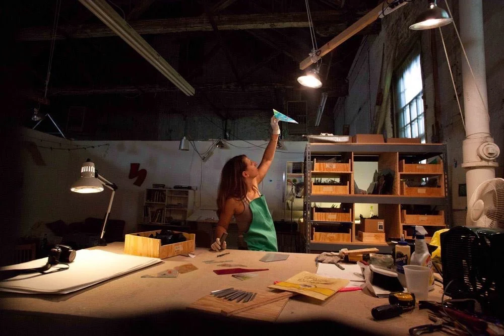 Claudia selecting colors for a panel.