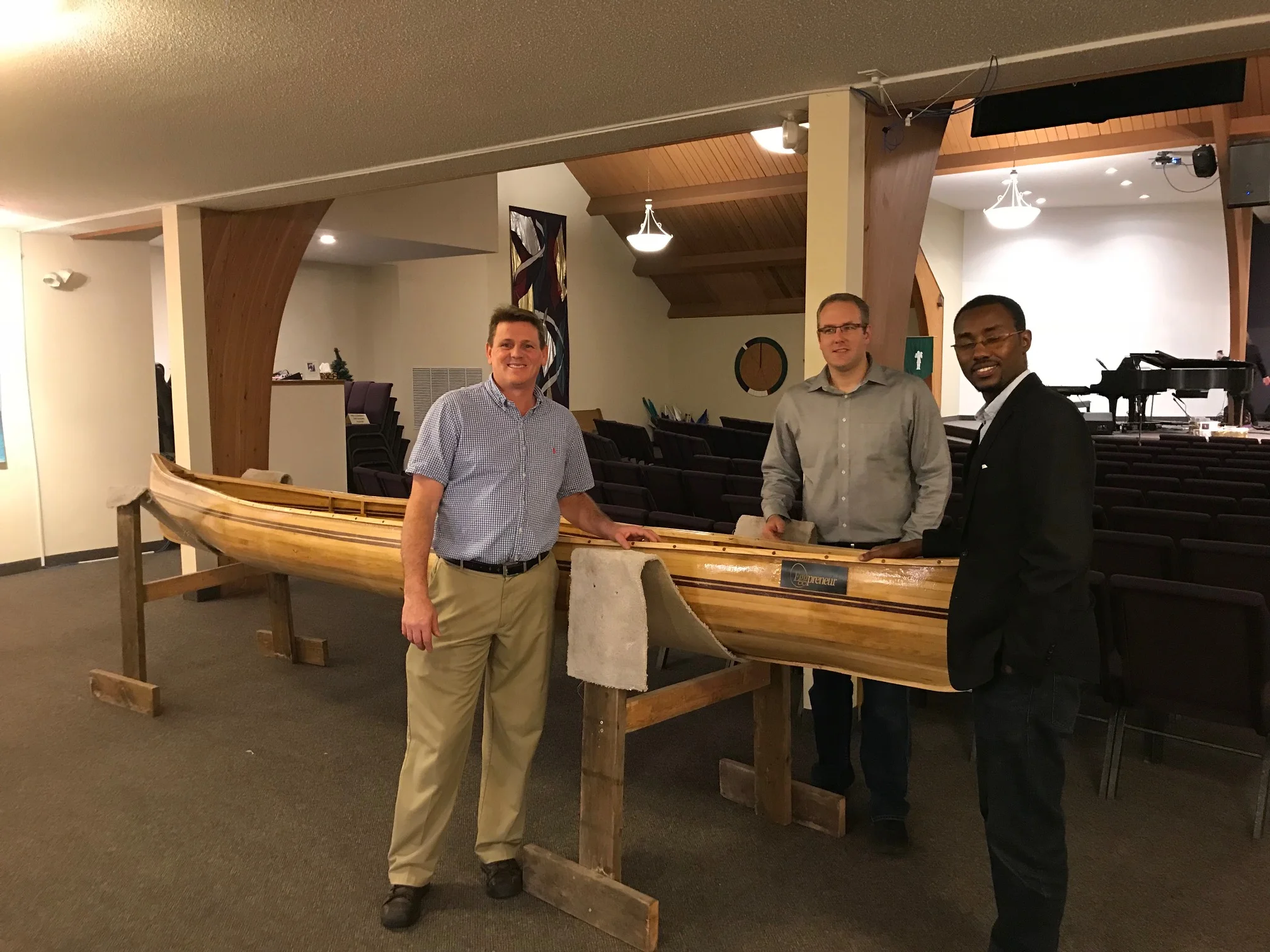 Matt with two of the men who built the canoe.
