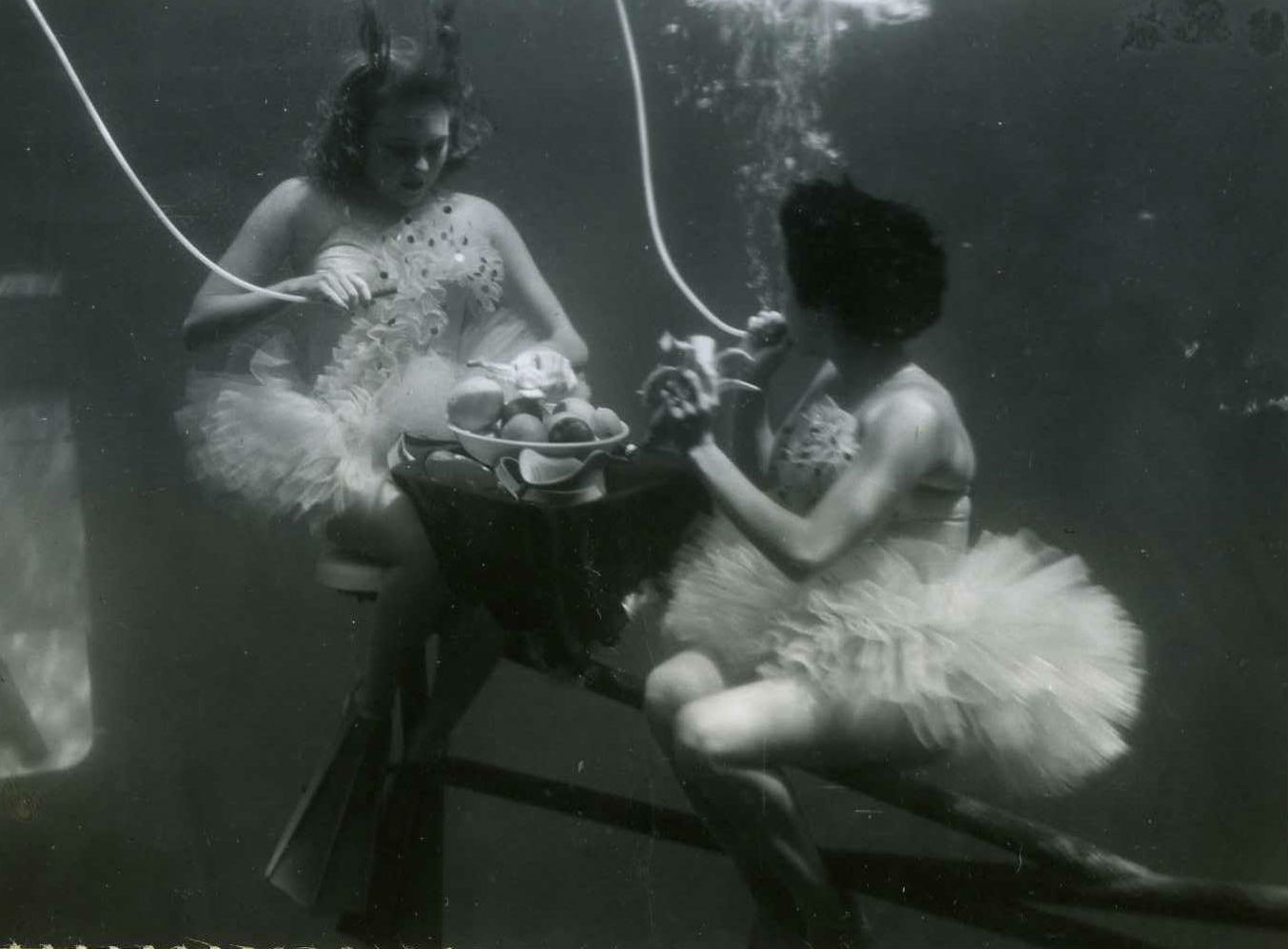 vintage aquamaids eating and drinking underwater at aquarena springs in san marcos texas.jpg