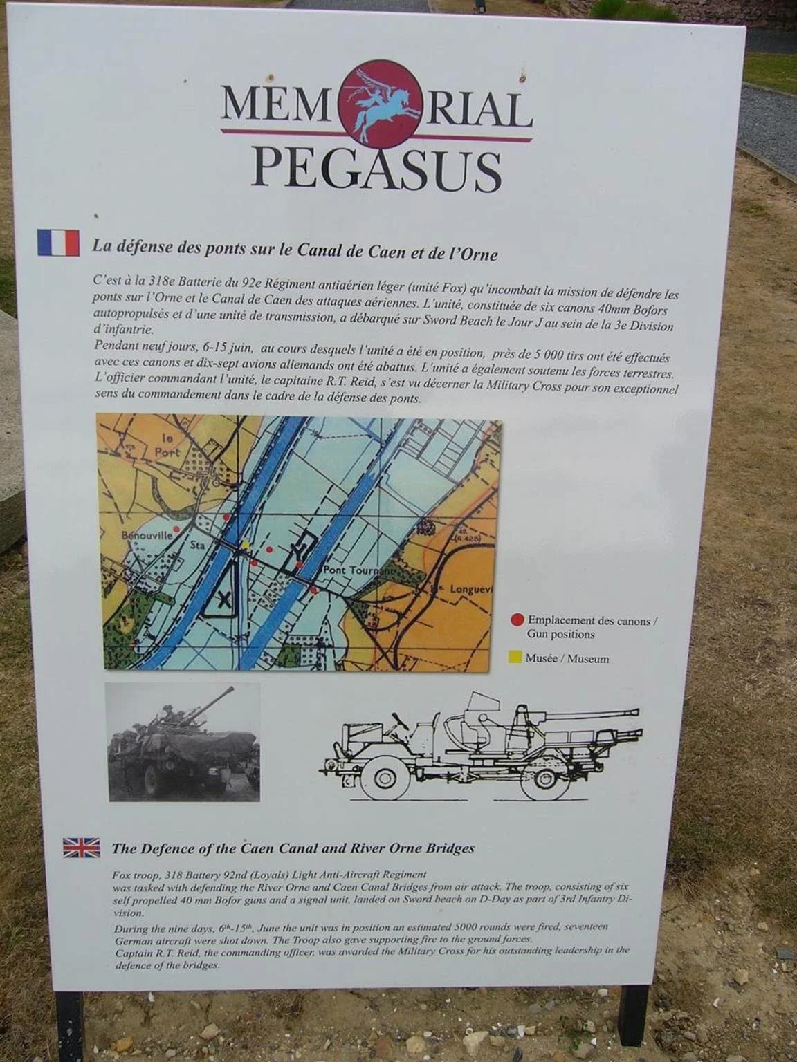 The plaque is next to a Bofors gun in the museum grounds